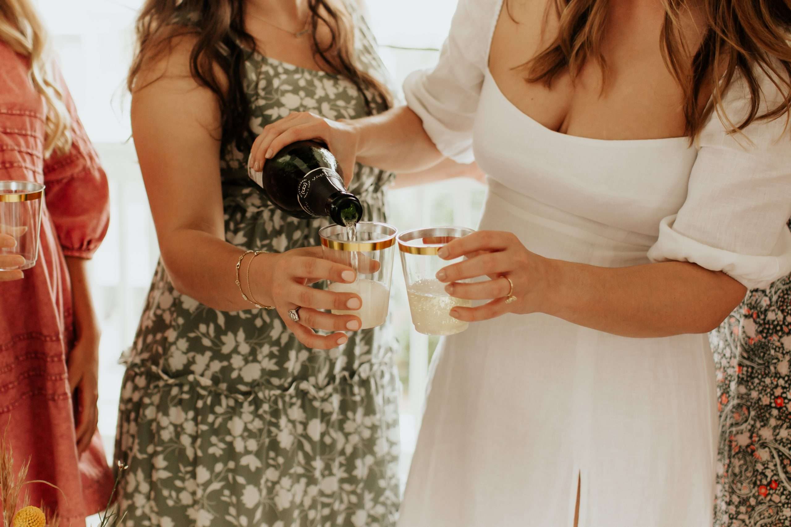 bride pouring champagne