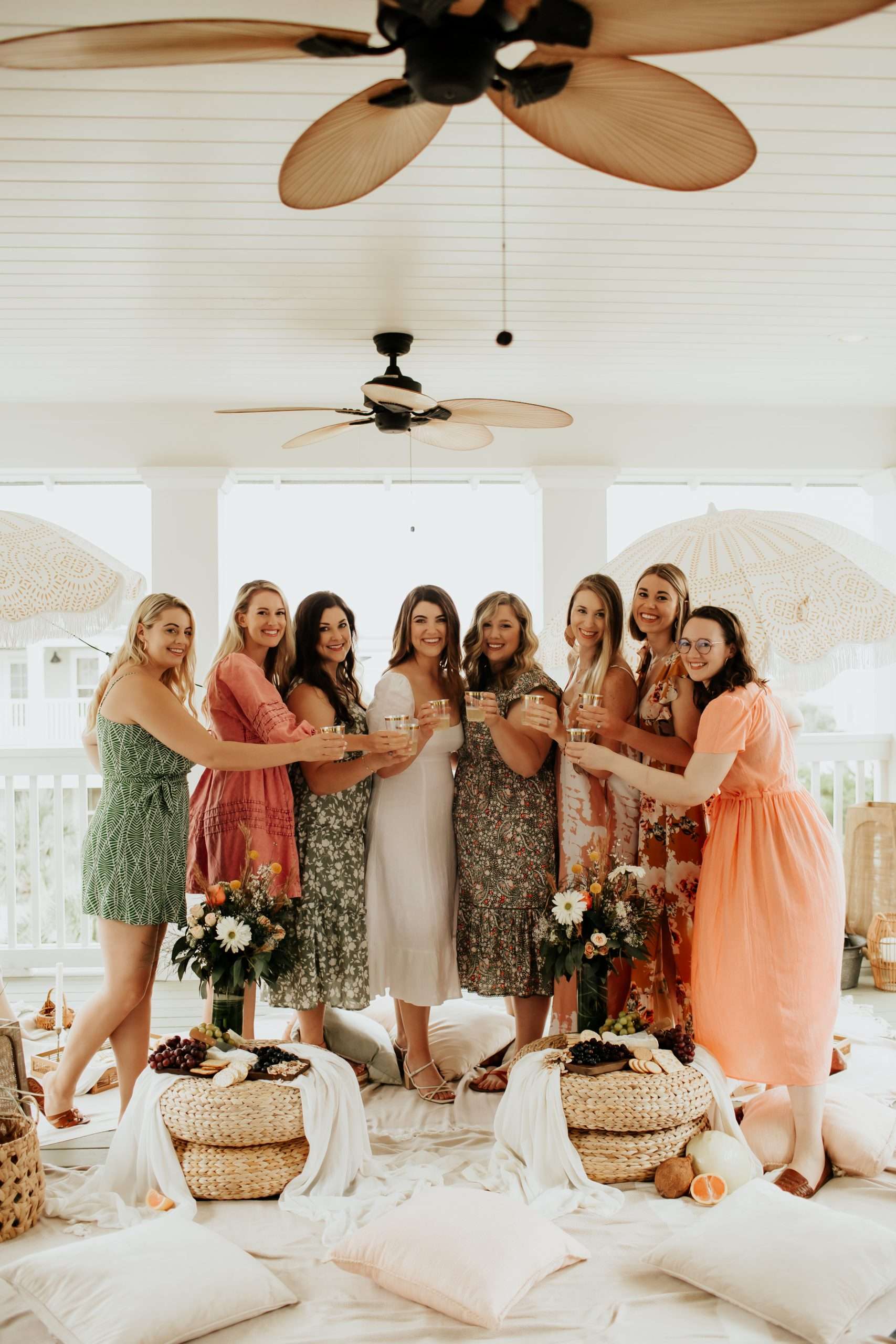 bride and bridesmaids cheersing