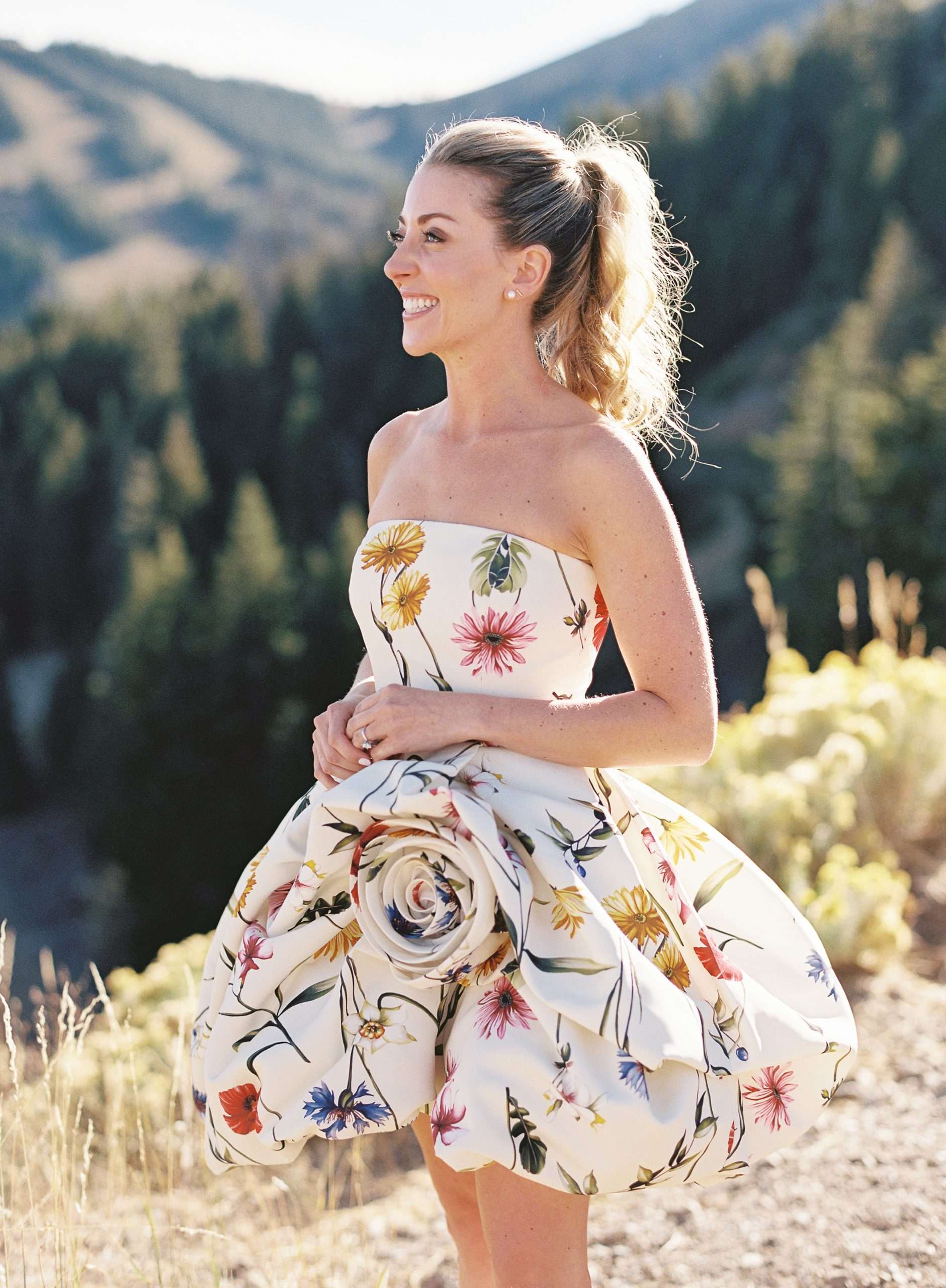 bride in floral dress and high ponytail