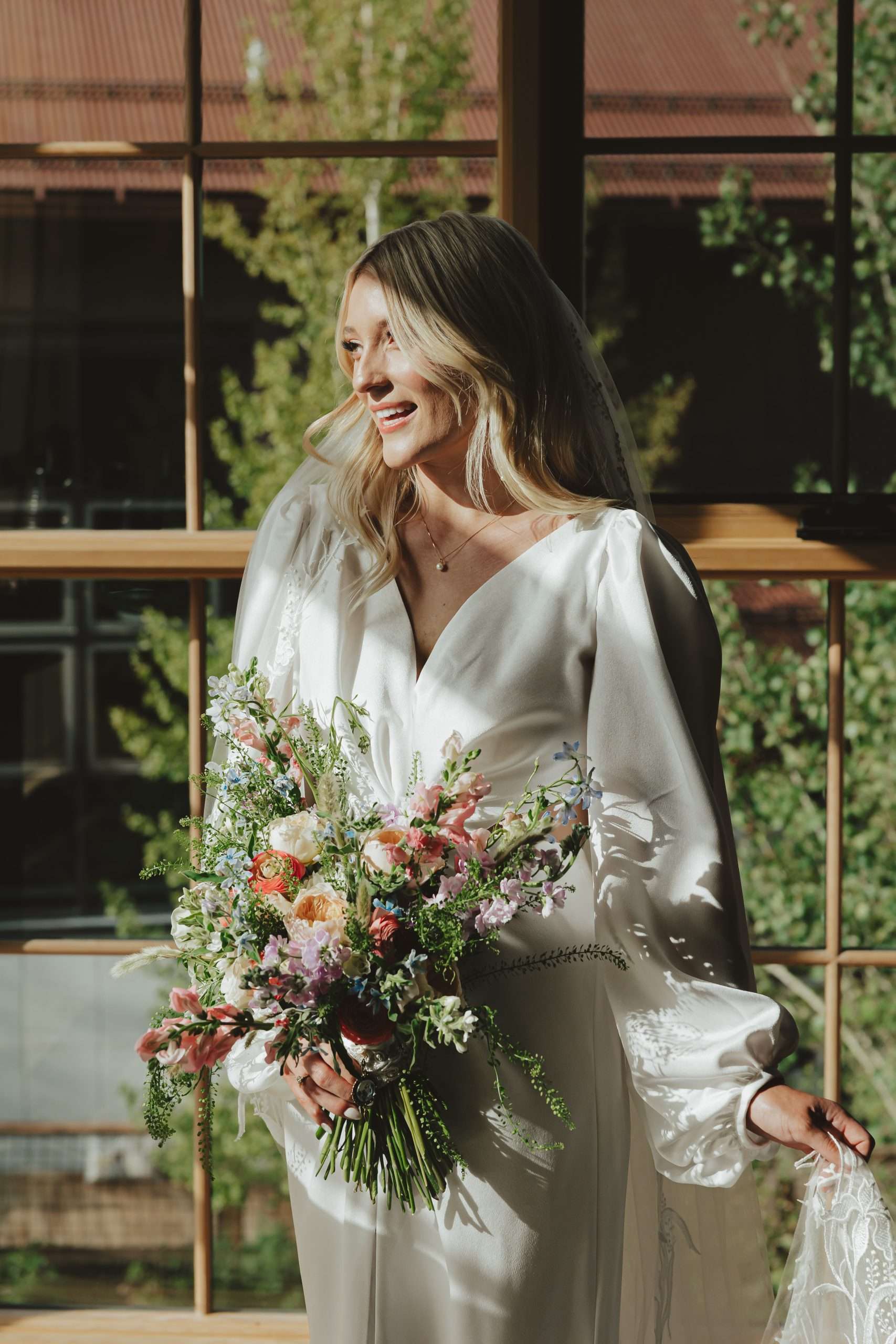 bridal portrait with sunlight coming through the window