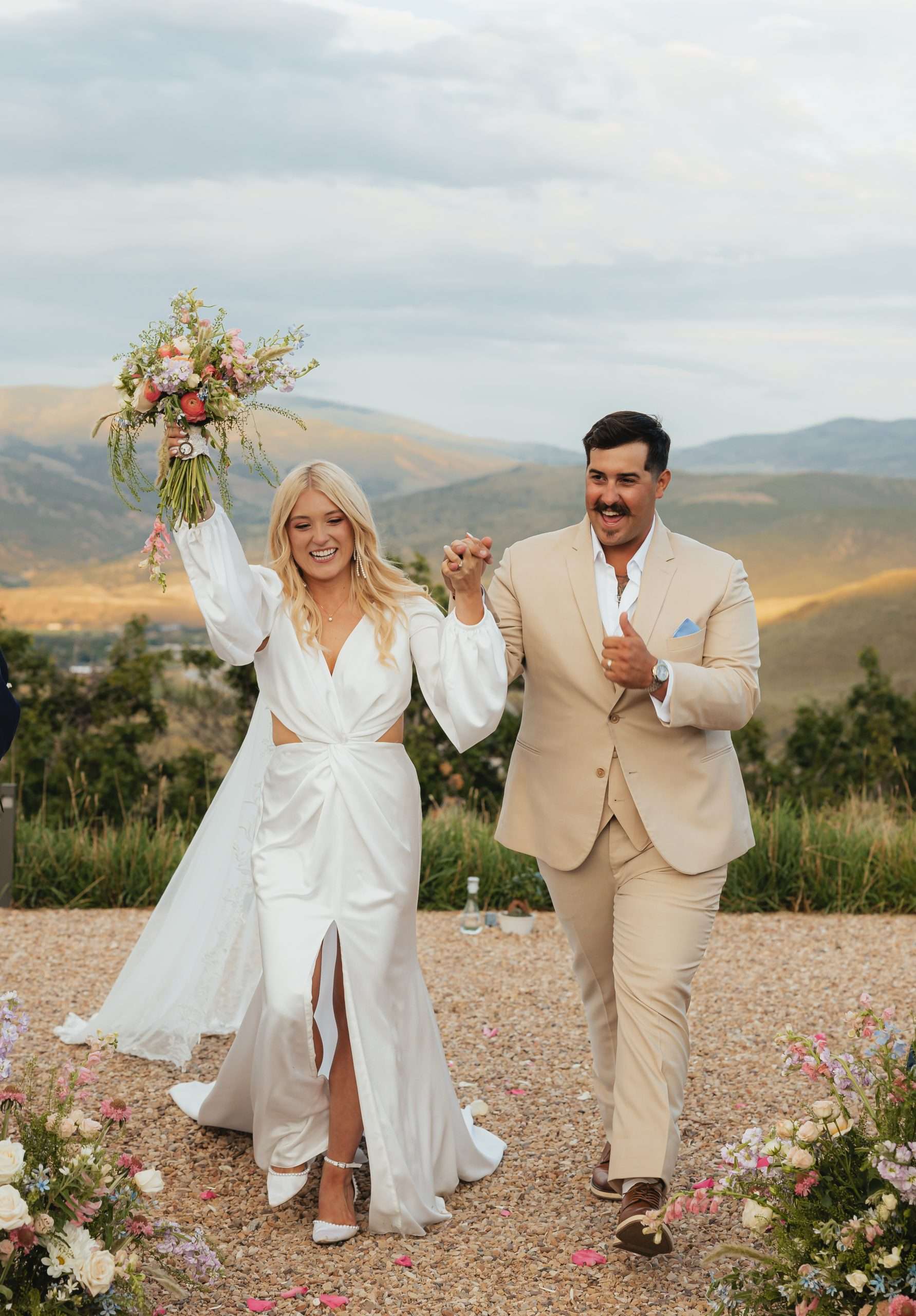 bride and groom walking down the aisle at high west distillery