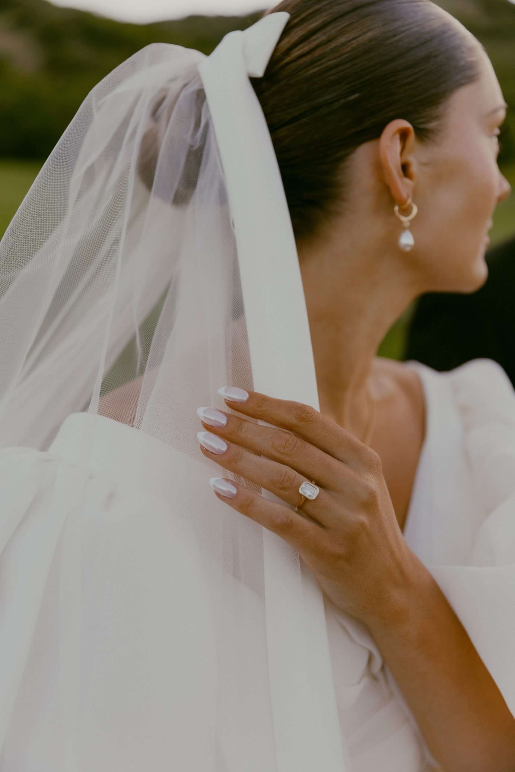 bride touching her veil utah wedding bridal photos
