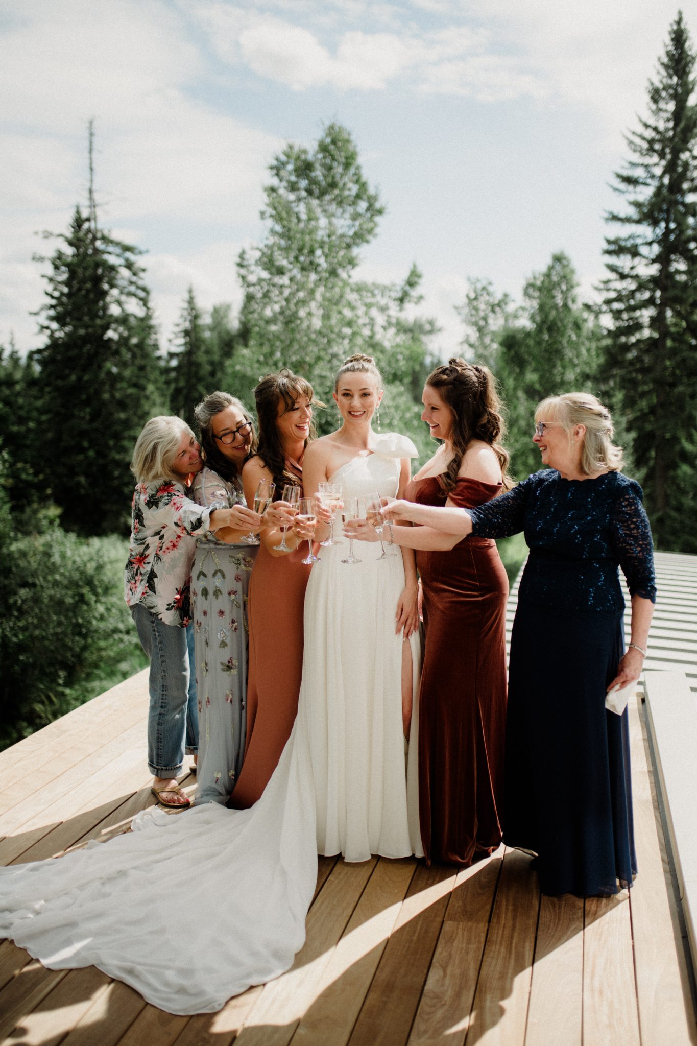 bride's bridesmaids with champagne for a montana summer wedding