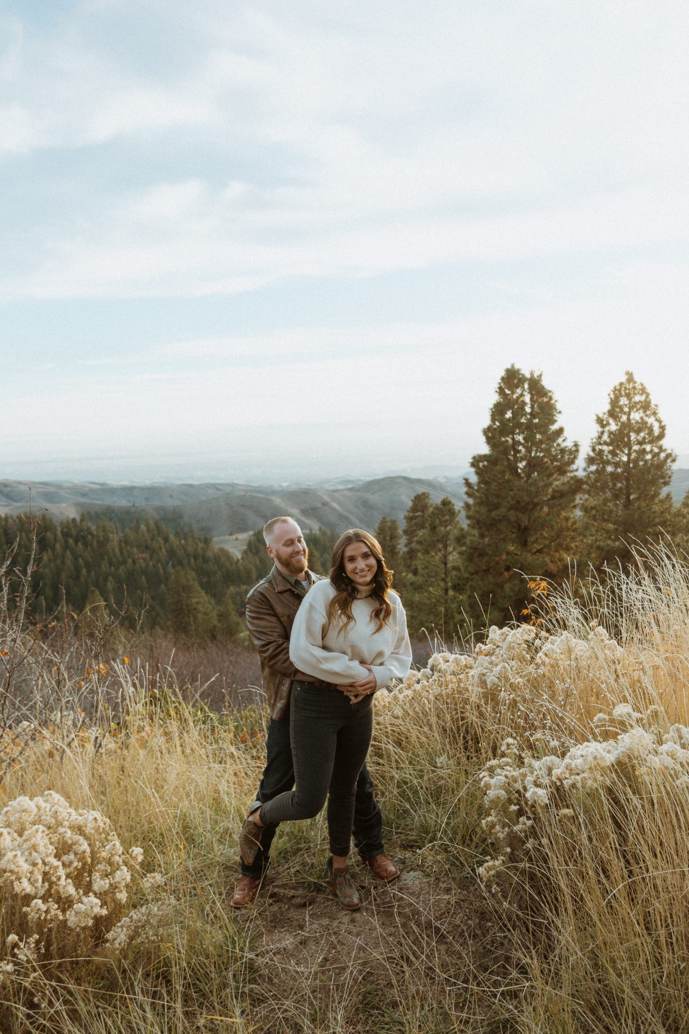 Boise Idaho Winter Engagement Session couple in the meadows, hugging