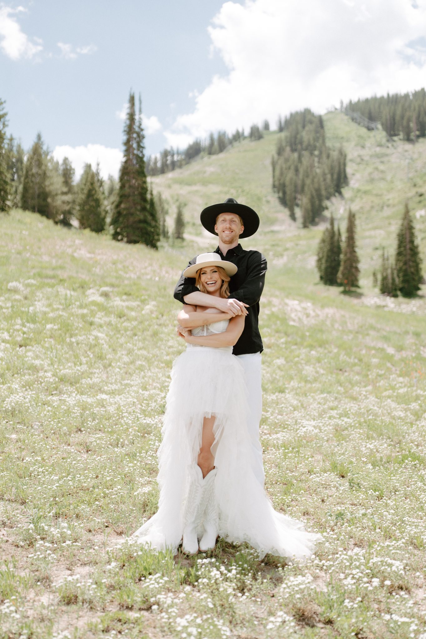 couple hugging in the meadow for their Mountain Utah Engagement Session