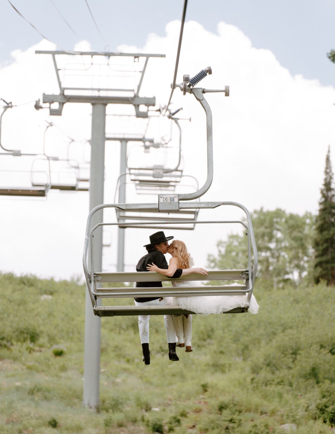 couple kissing on the gondola for their Mountain Utah Engagement Session