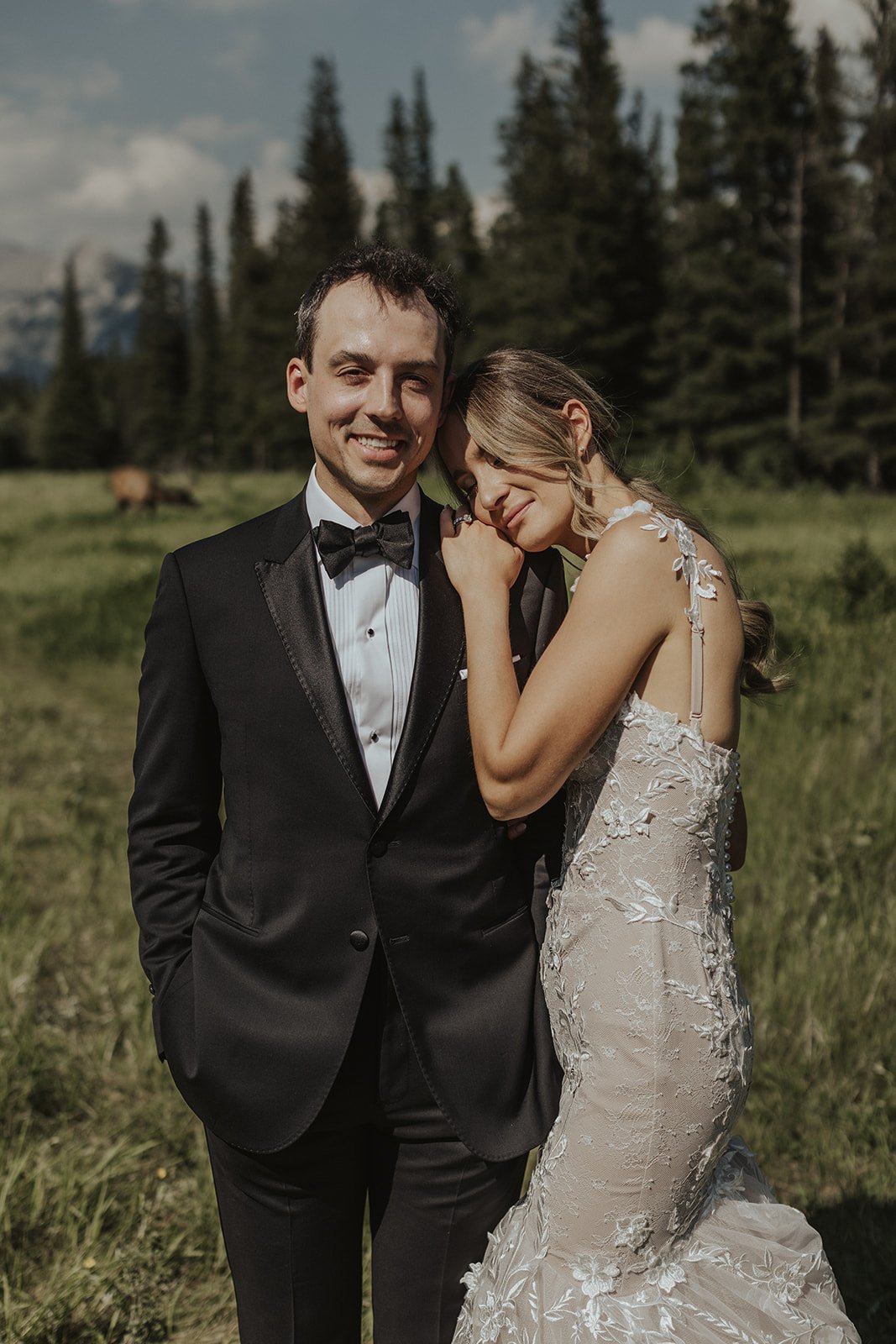 refined alberta wedding couple posing in a field