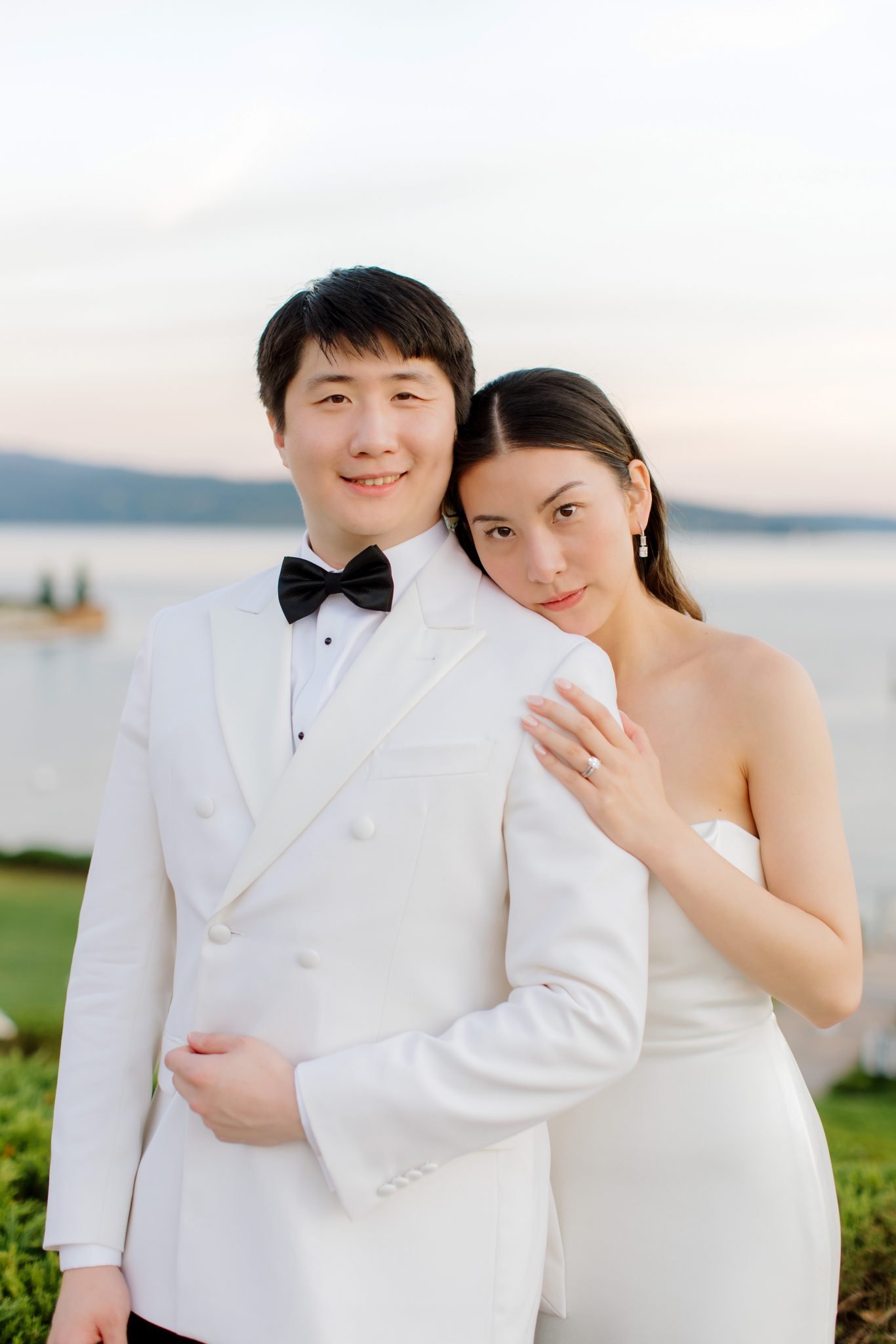 couple posing in front of the lake for their idaho summer wedding