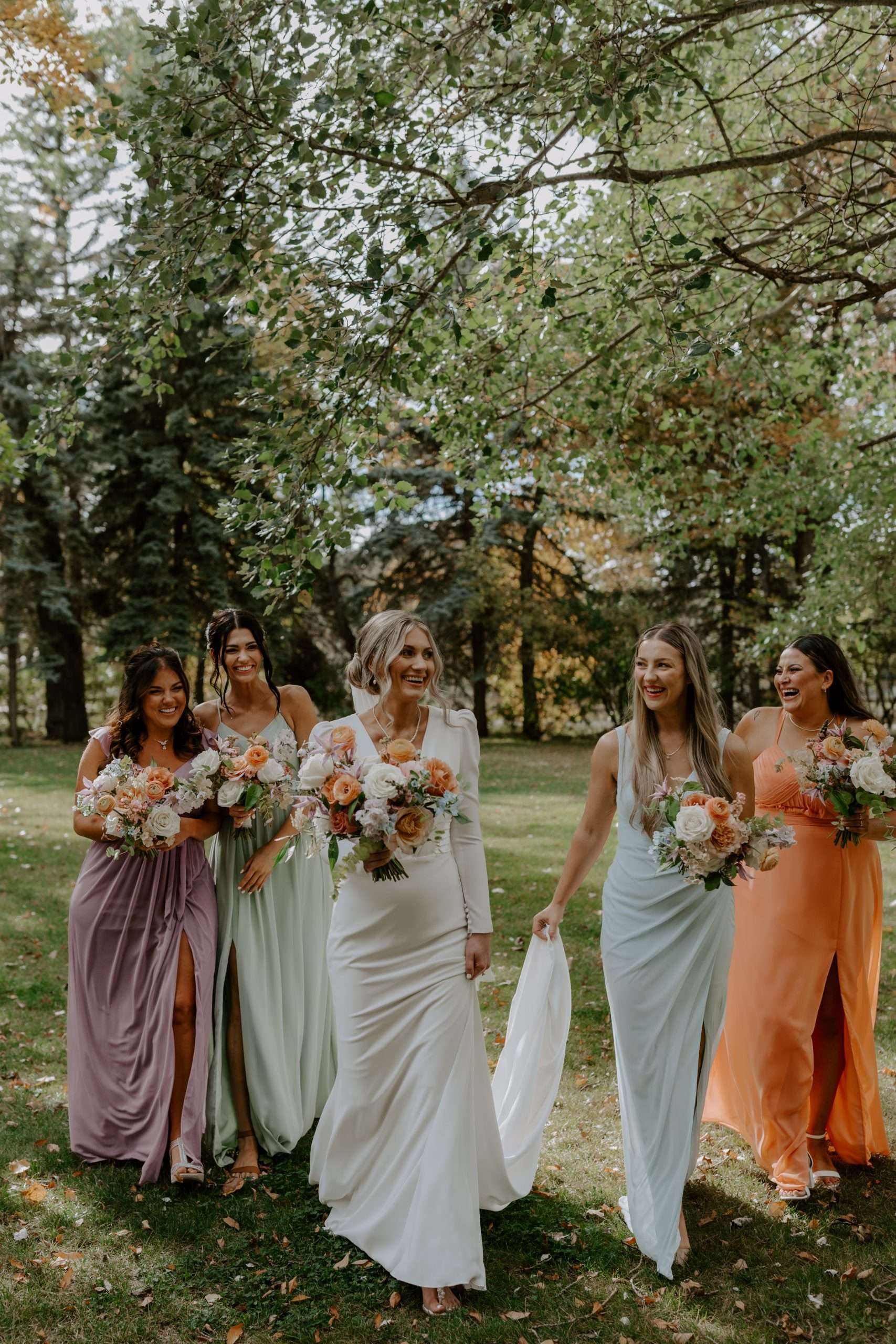 colorful bridesmaid dresses with colorful bouquets for an alberta wedding