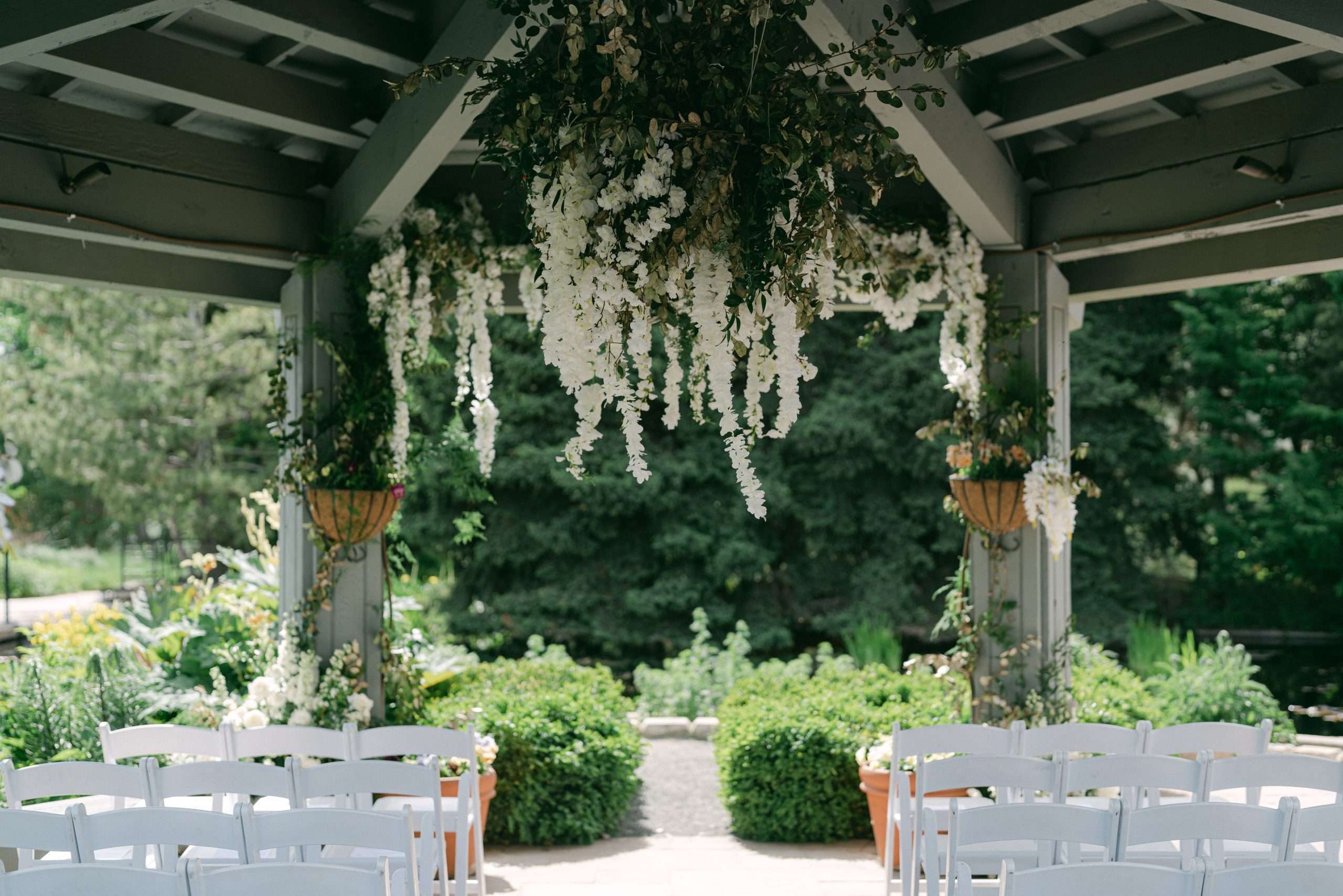 denver garden wedding ceremony with hanging white florals