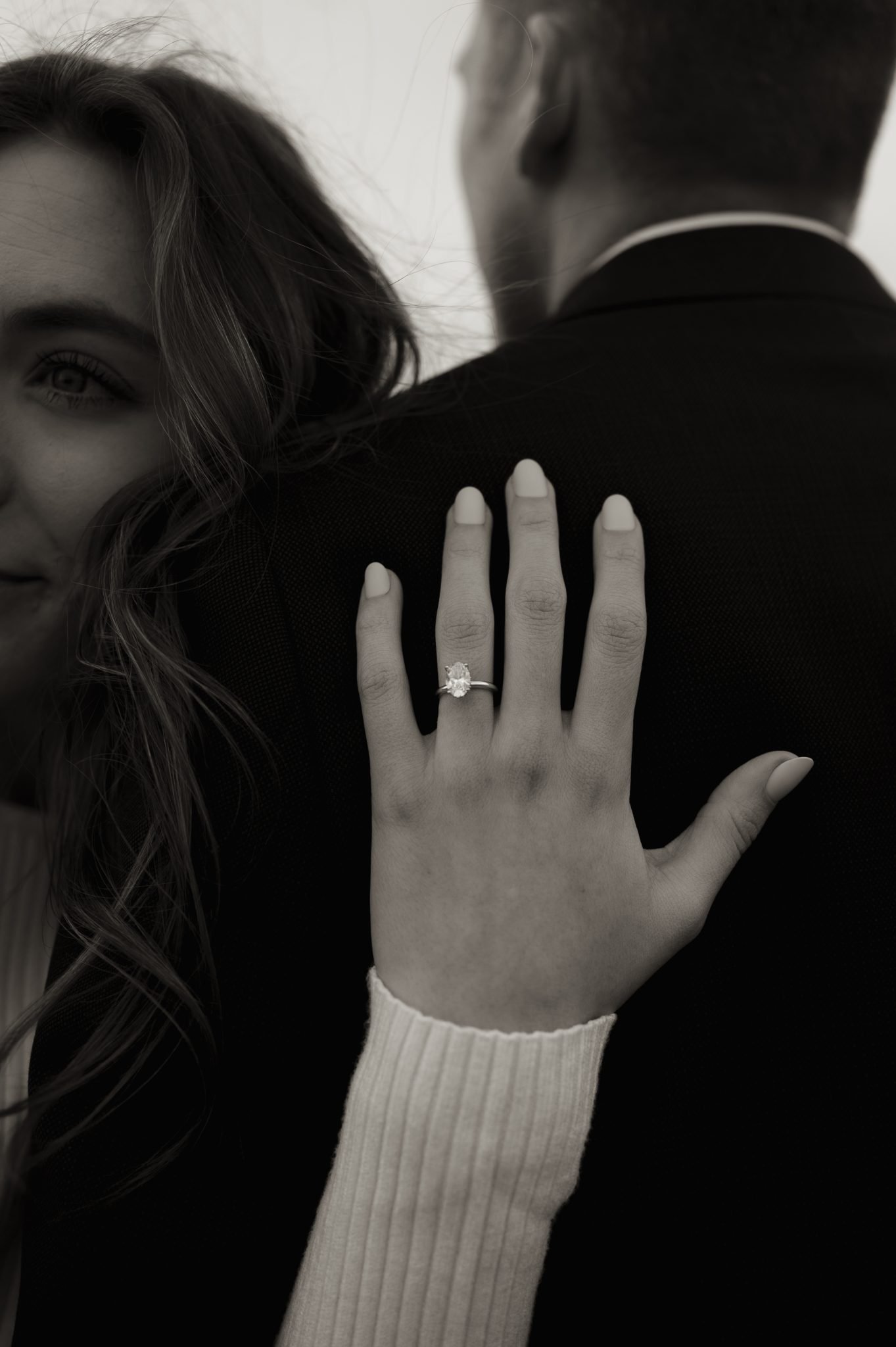Albuquerque New Mexico Fall Engagement session with her arm under his arm showing off her engagement ring