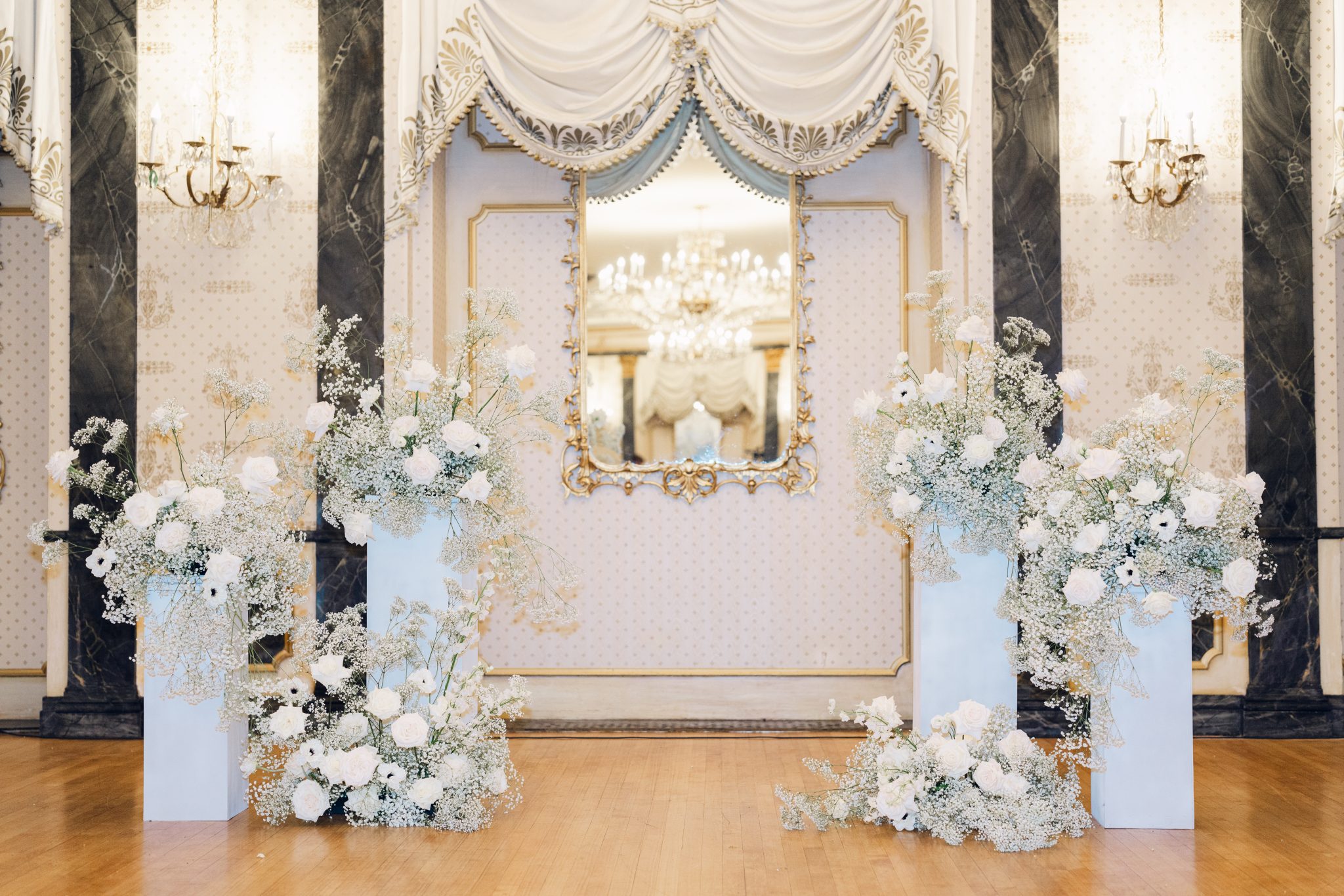 Colorado Springs Summer Wedding stunning ceremony altar florals sitting on different height podiums at The Broadmoor hotel