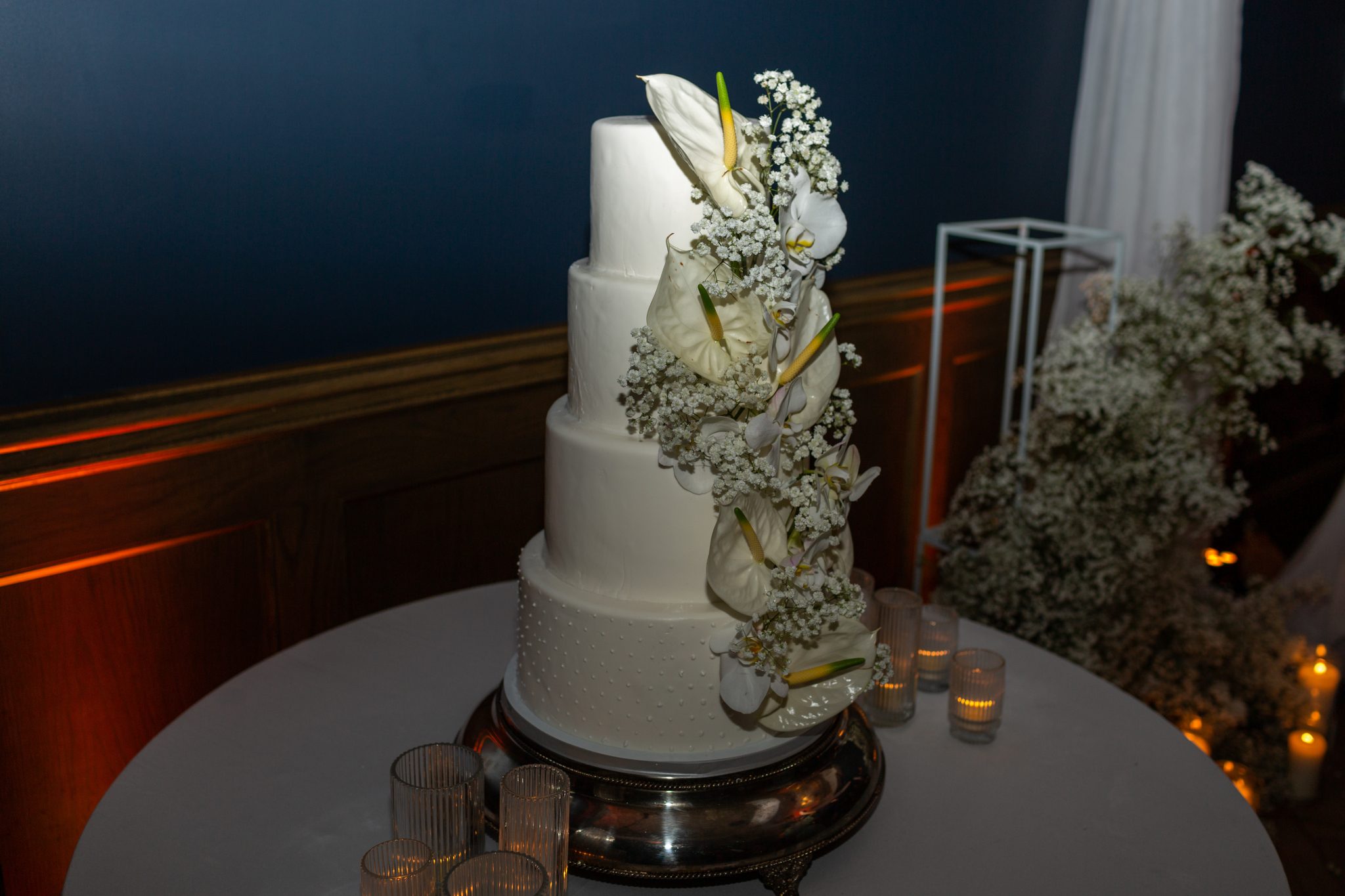Denver Botanic Gardens Colorado Wedding four-tiered white wedding cake decorated with florals