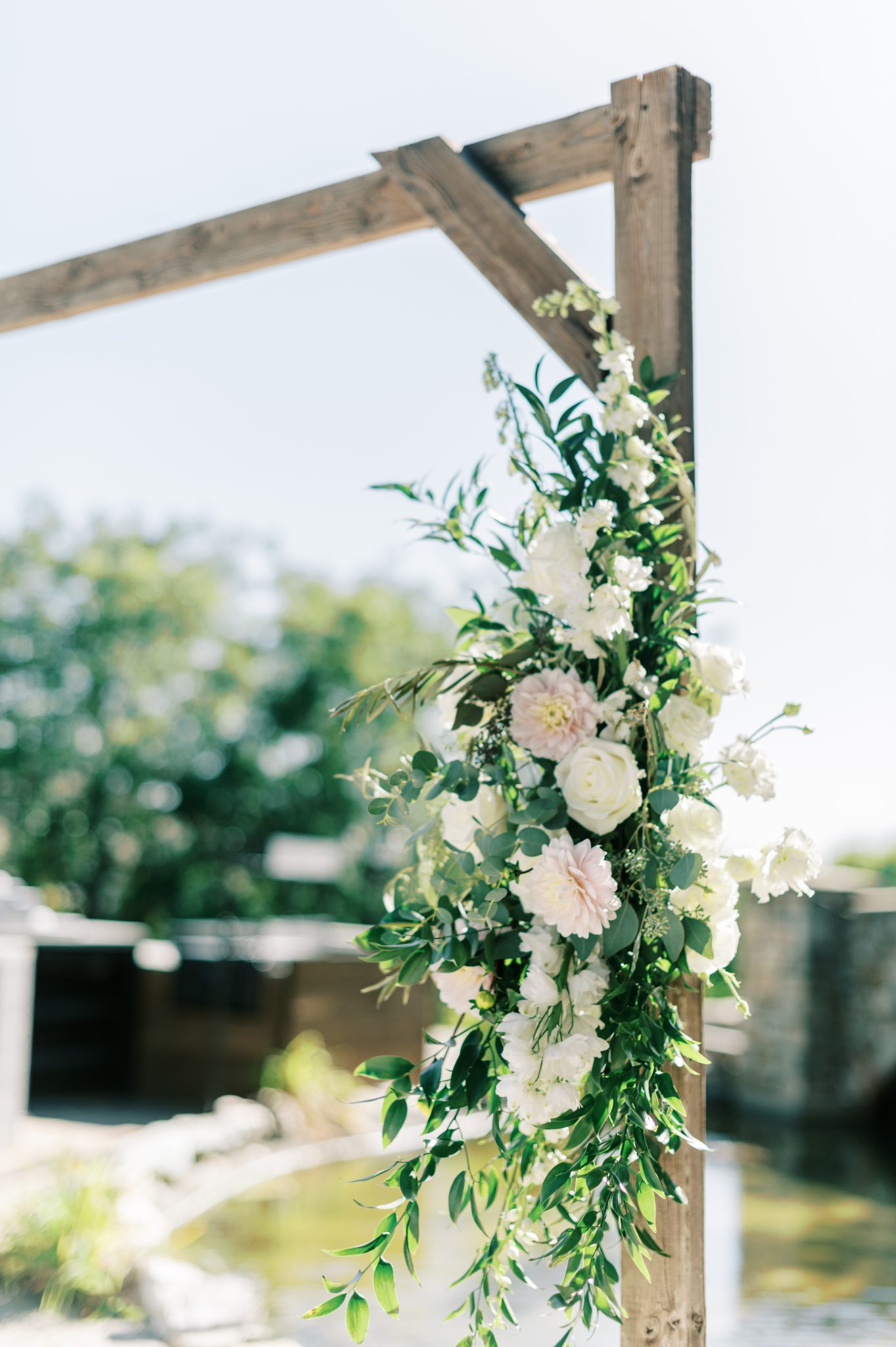 Idaho Summer Wedding floral accent decoration on the ceremony arch