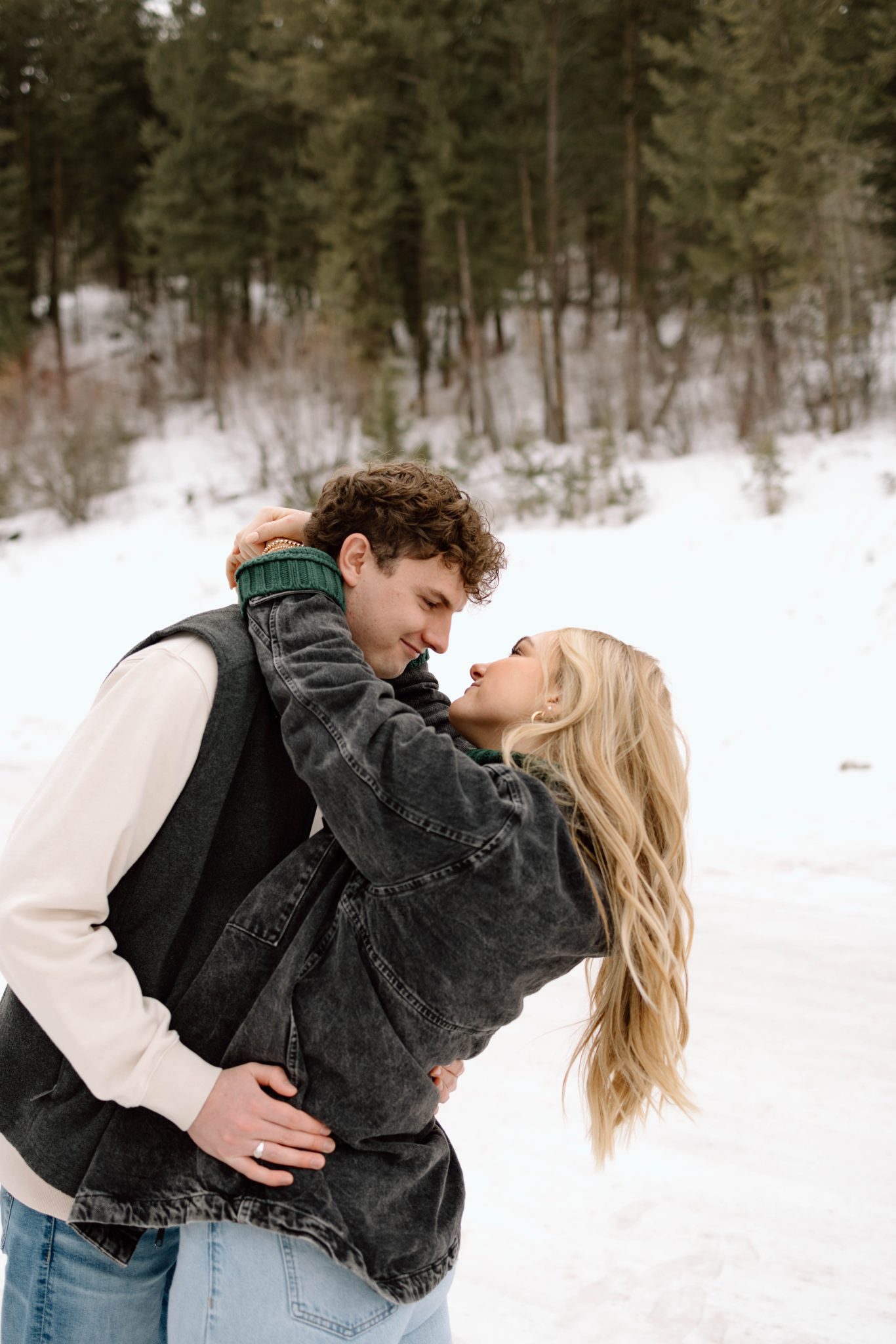 Idaho Winter Engagements couple hugging and looking into each other's eyes