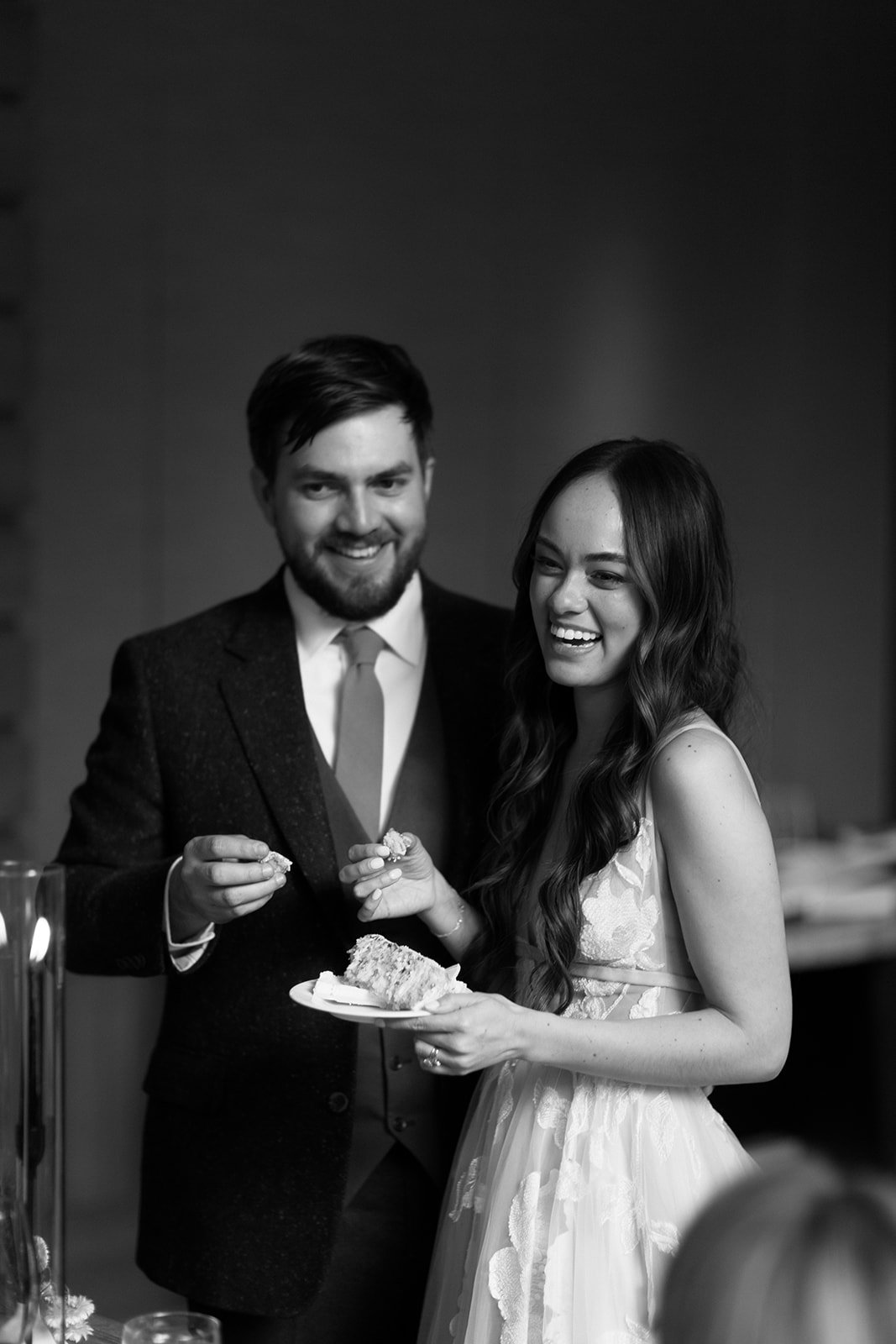 bride and groom enjoying their cake at their Summer whistler wedding