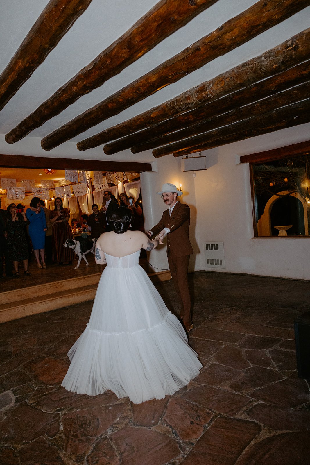 The Stakeout Taos Wedding couple having their first dance as guests watch