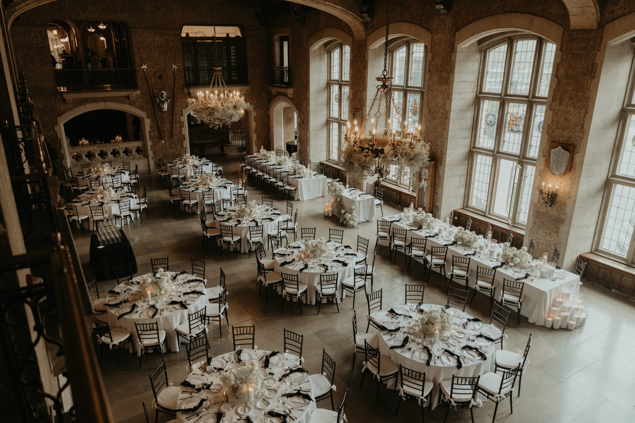 Fairmont Banff Springs Wedding dinner reception with white and black decor items with baby's breath and white florals