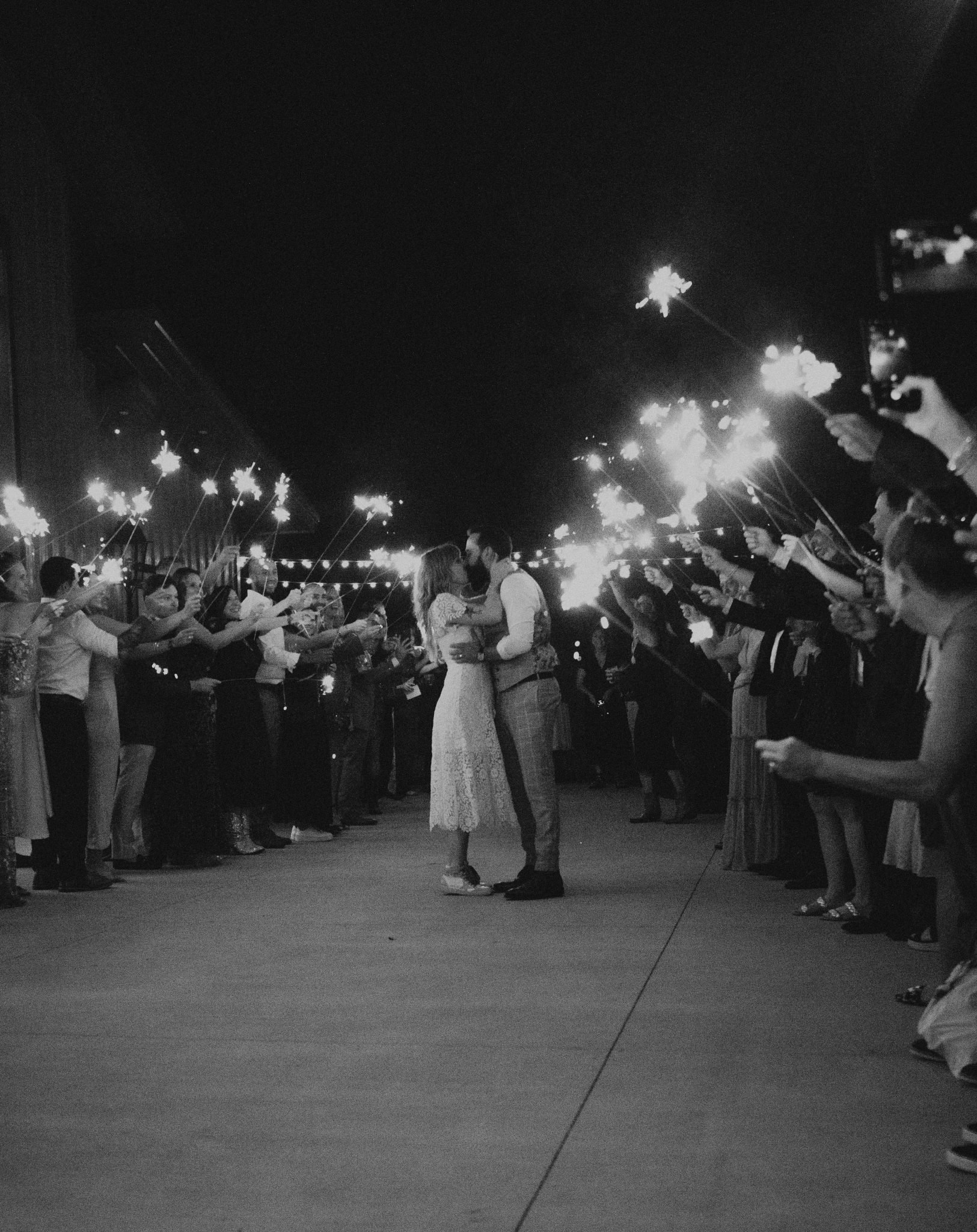 Carbondale Colorado Summer Wedding guests sending the couple off for the night with cold sparklers