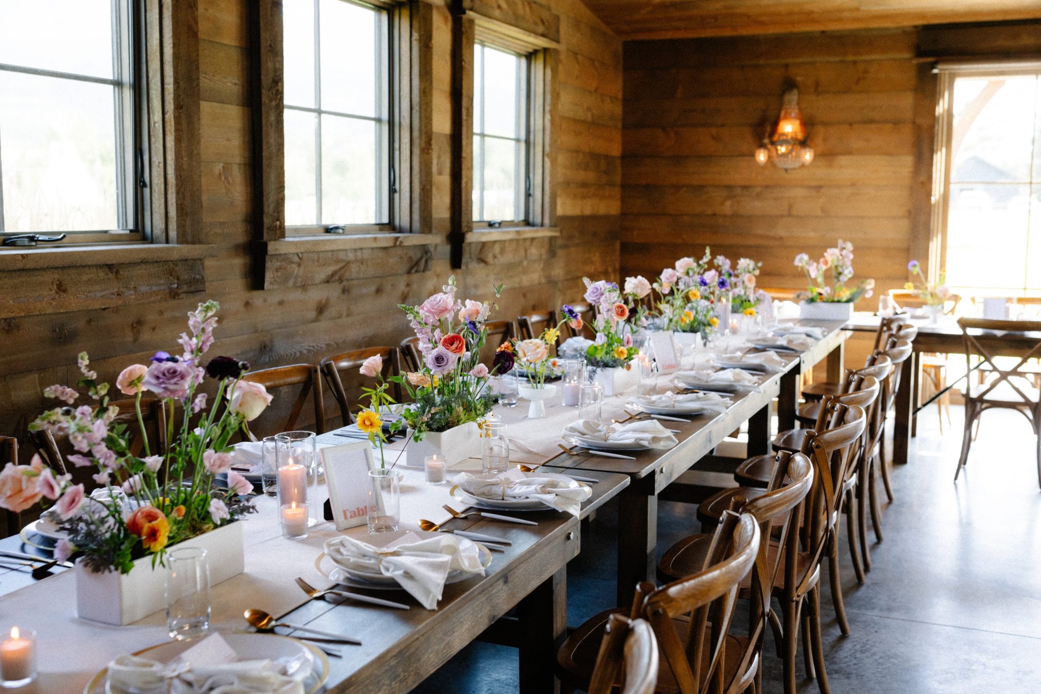 Copper Rose Ranch Wedding wooden long tables with garden floral boxes down the middle
