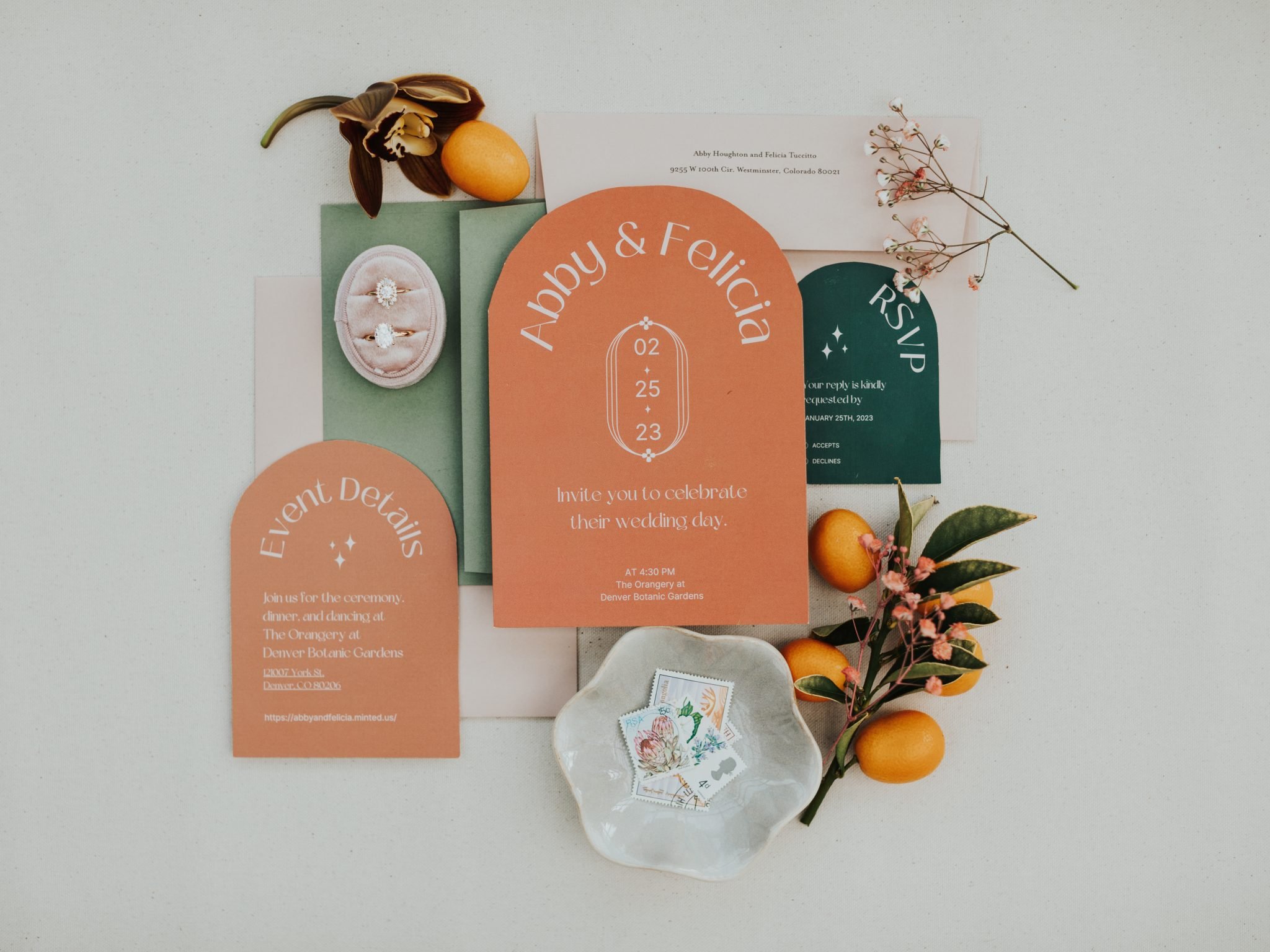 Denver Botanic Gardens Wedding details with rings and the couple's invitation set