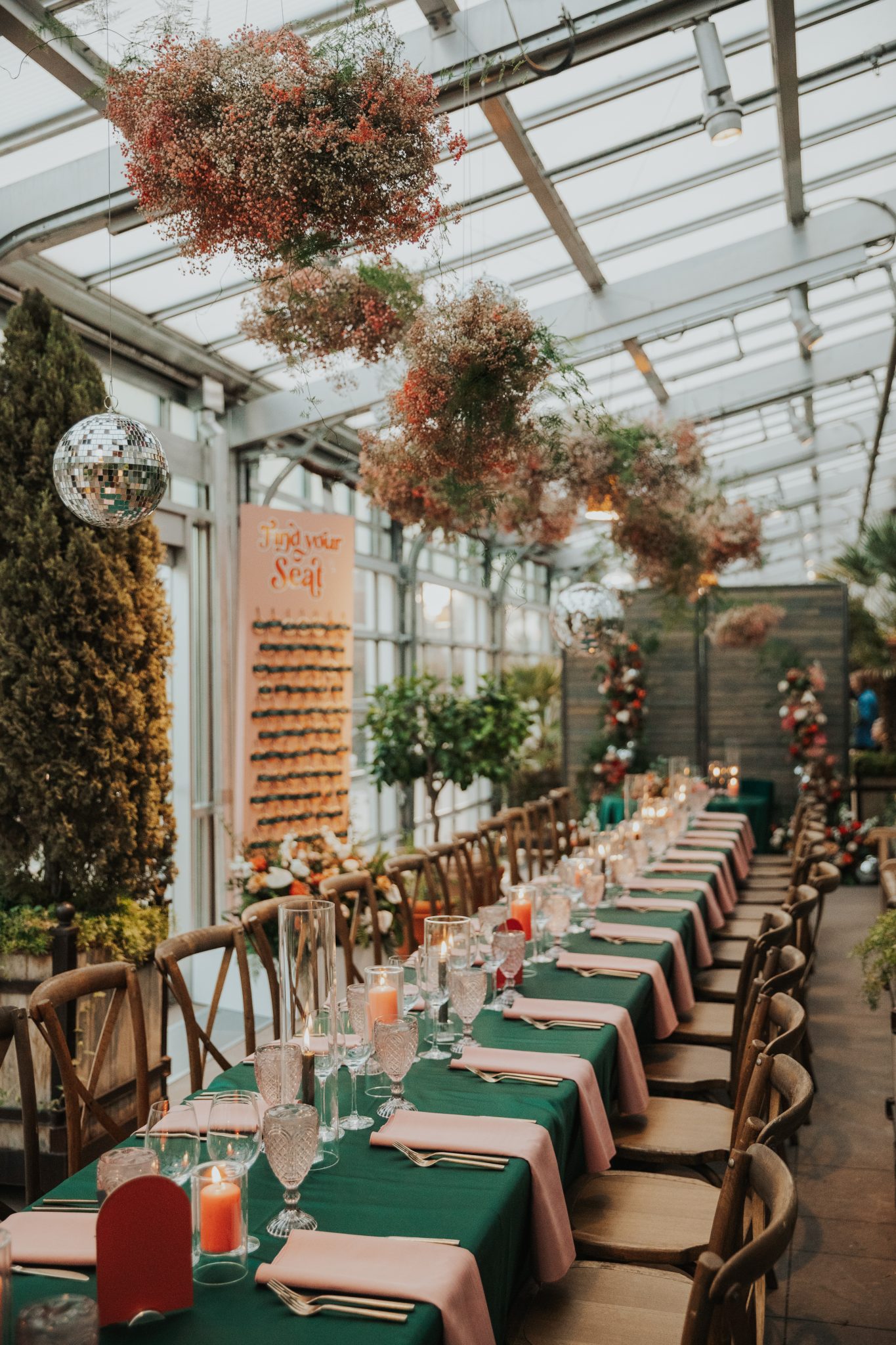 Denver Botanic Gardens Wedding colorful reception area with hanging florals, vibrant table decor and hanging disco balls