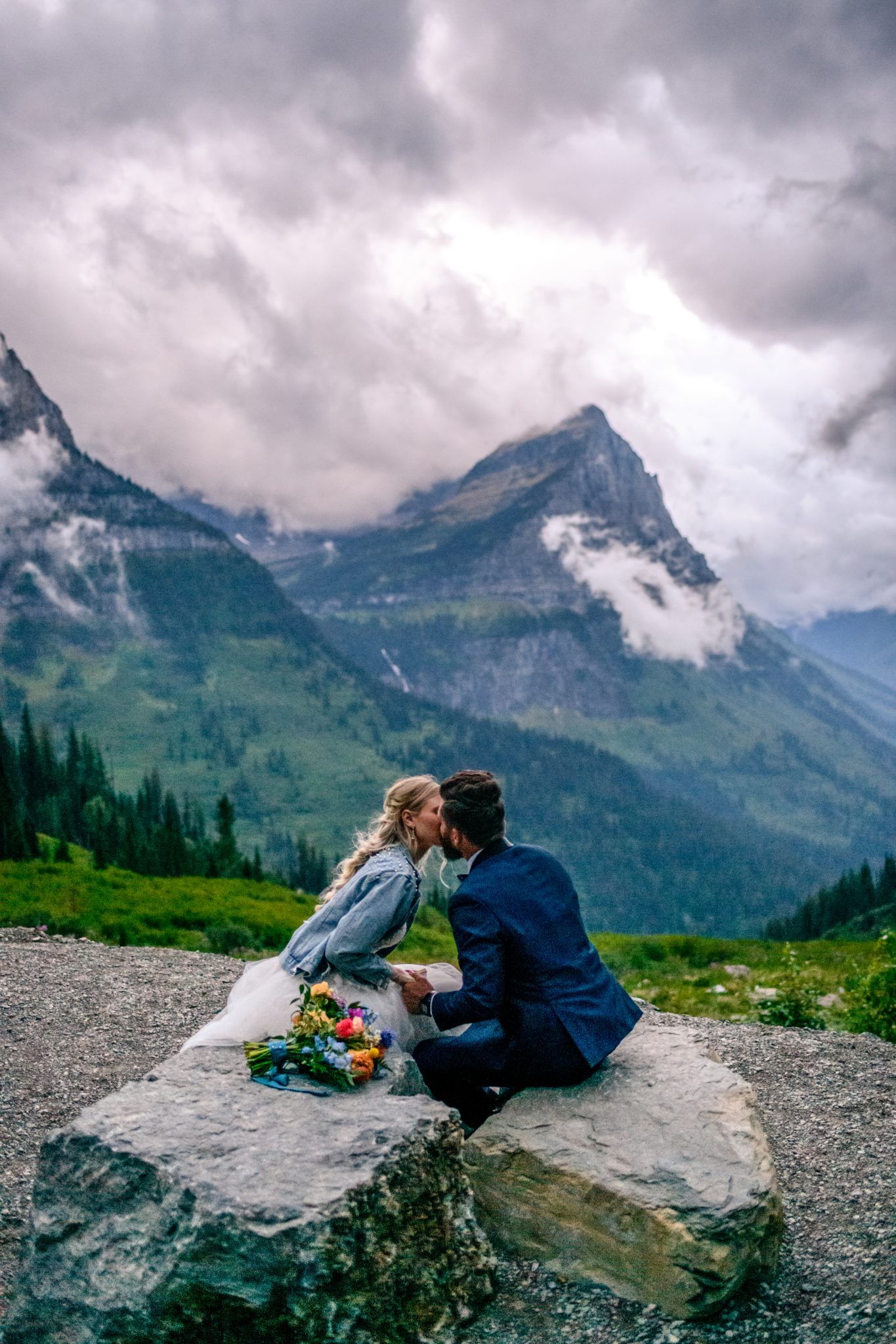 Glacier National Park Elopement couple kissing with breathtaking views