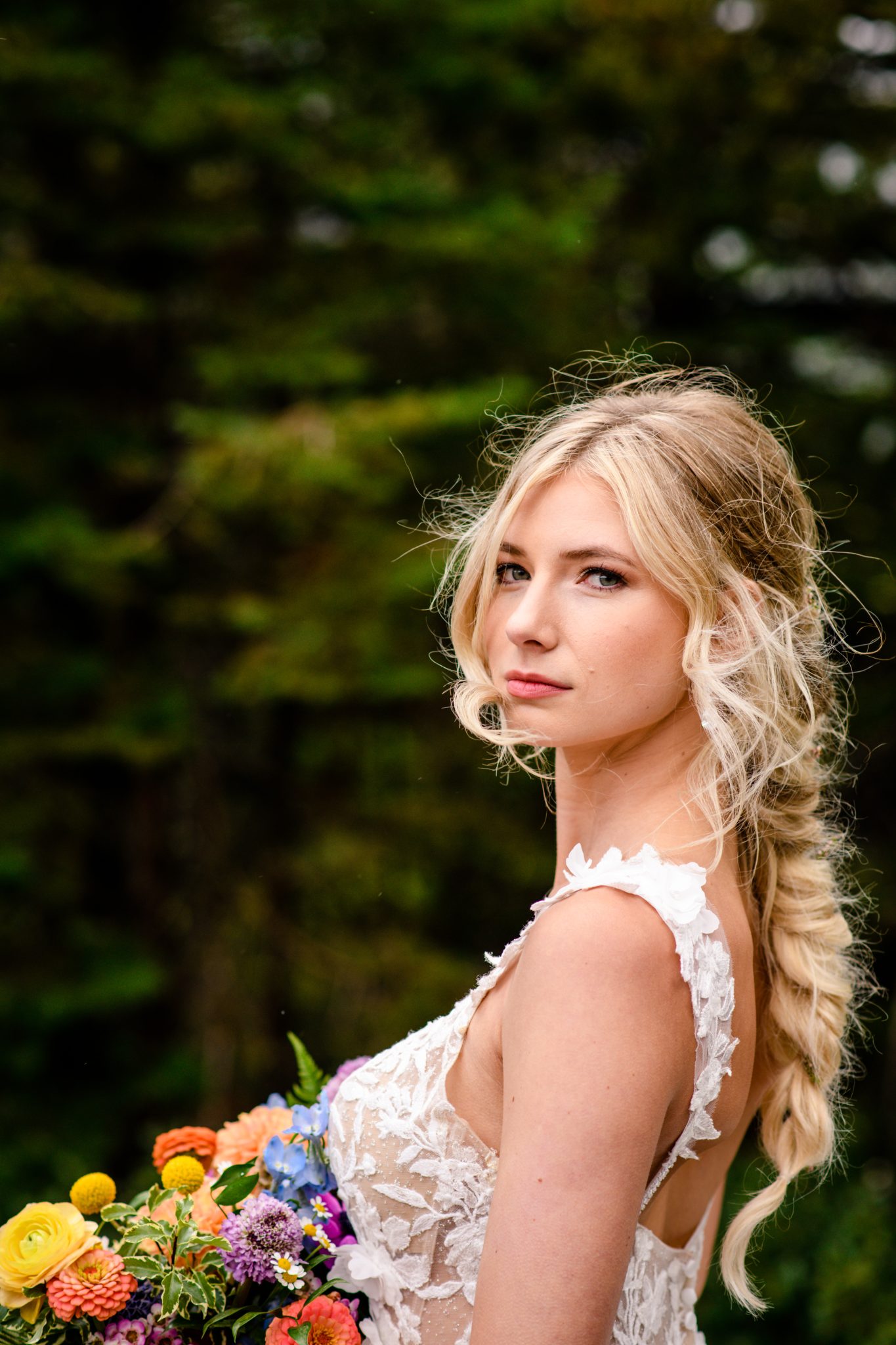 Glacier National Park Elopement bride holding her colorful bouquet