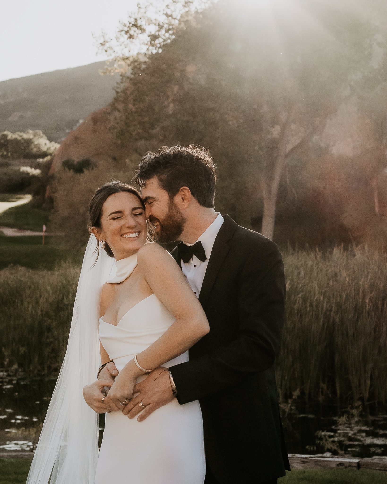 Littleton Colorado Wedding bride wearing a strapless wedding dress and a neck scarf as the groom wore a tuxedo