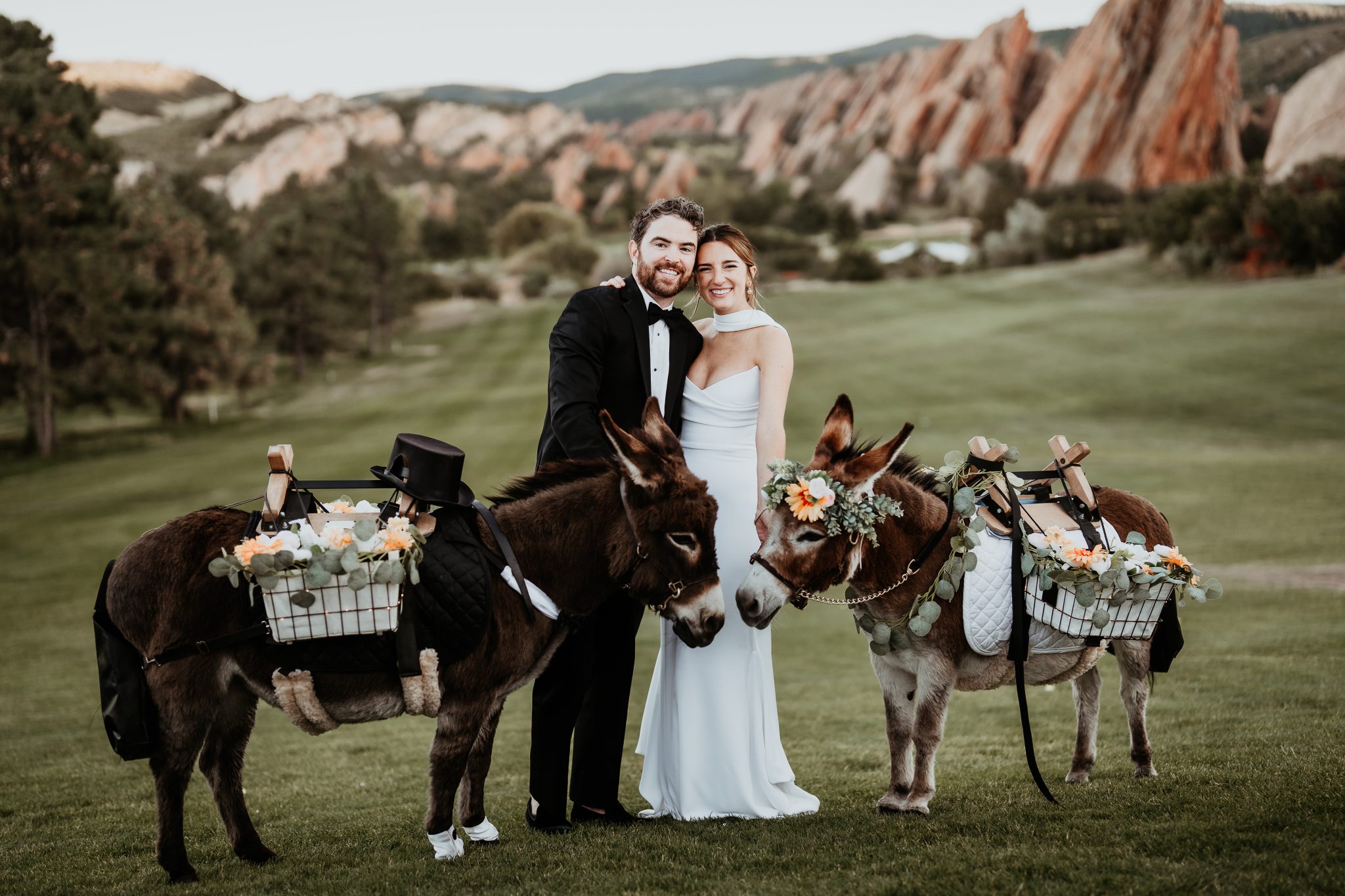Littleton Colorado Wedding couple with beverage burros during cocktail hour