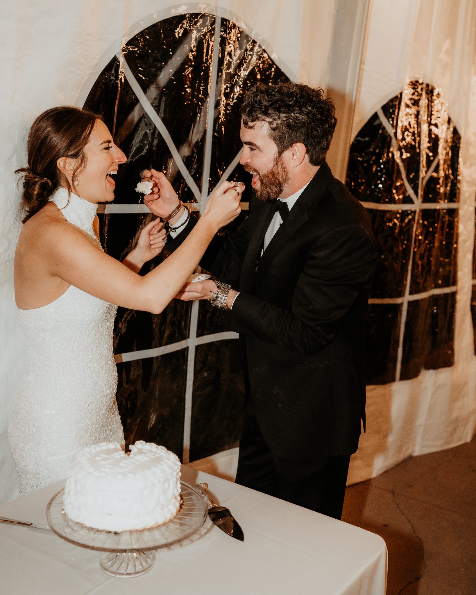 Littleton Colorado Wedding bride in her second dress as the couple cut their cake for the first time
