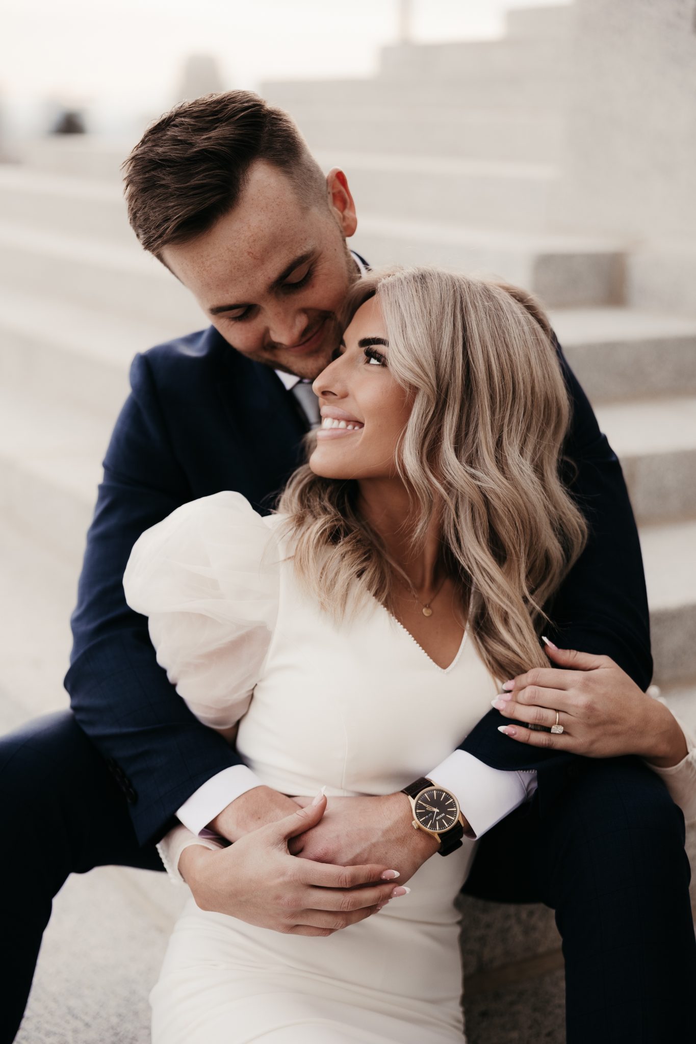 Utah Winter Engagement Session couple enjoying each other's presence in their elevated and sleek attire