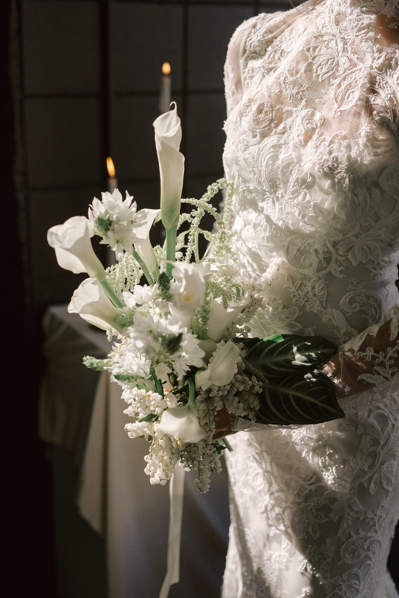 Bride holding a delicate white floral bouquet at Slate Vancouver Wedding.