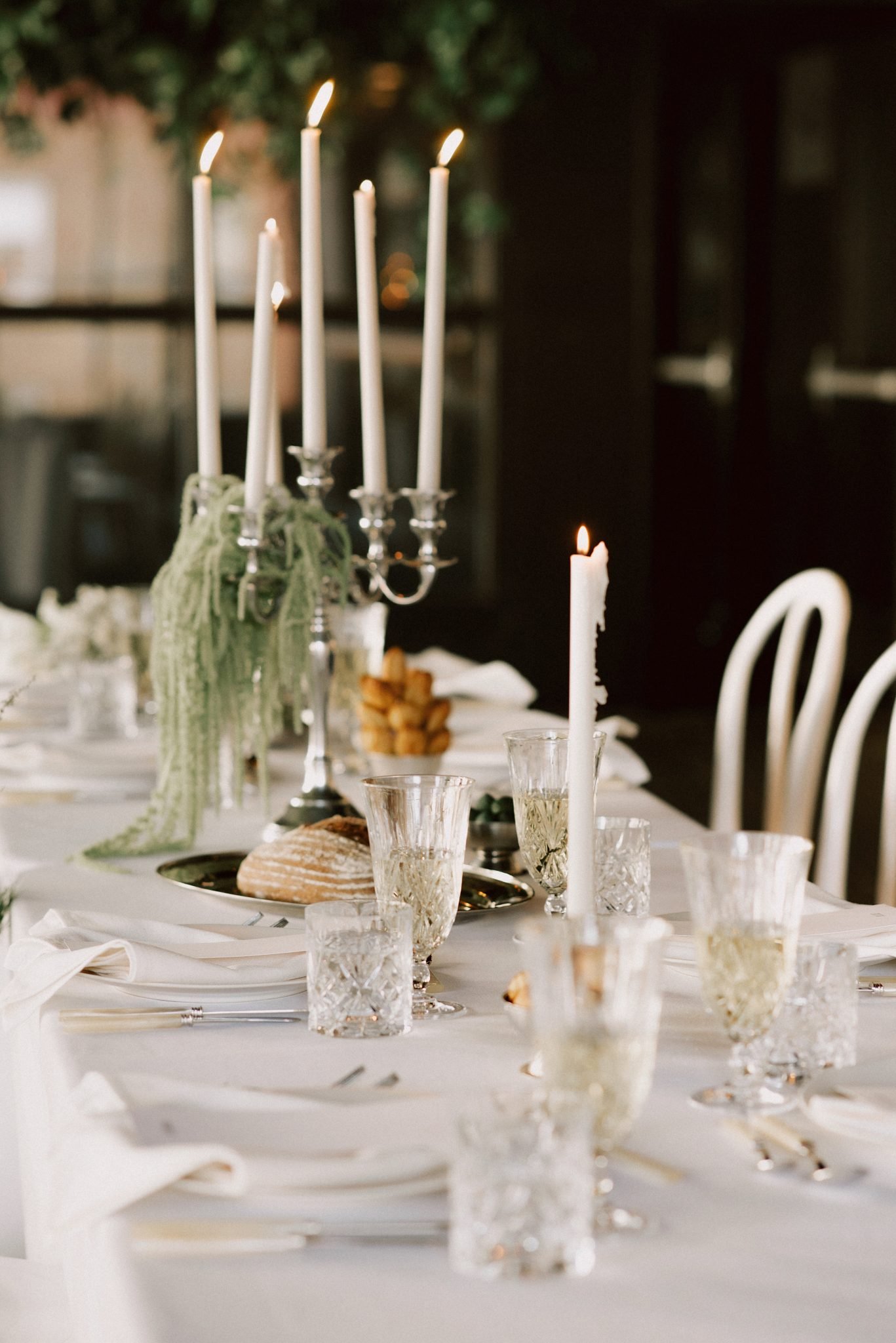 Elegant table setting with candlelight at Slate Vancouver Wedding reception.