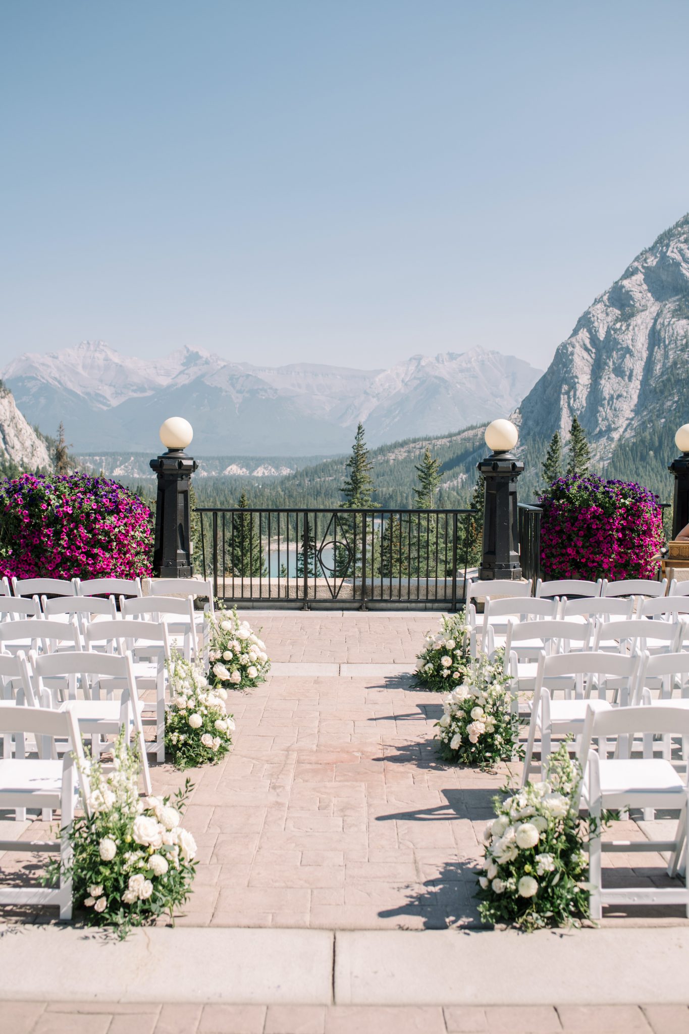 Ceremony setup with stunning mountain views at a Fairmont Banff Springs Wedding.