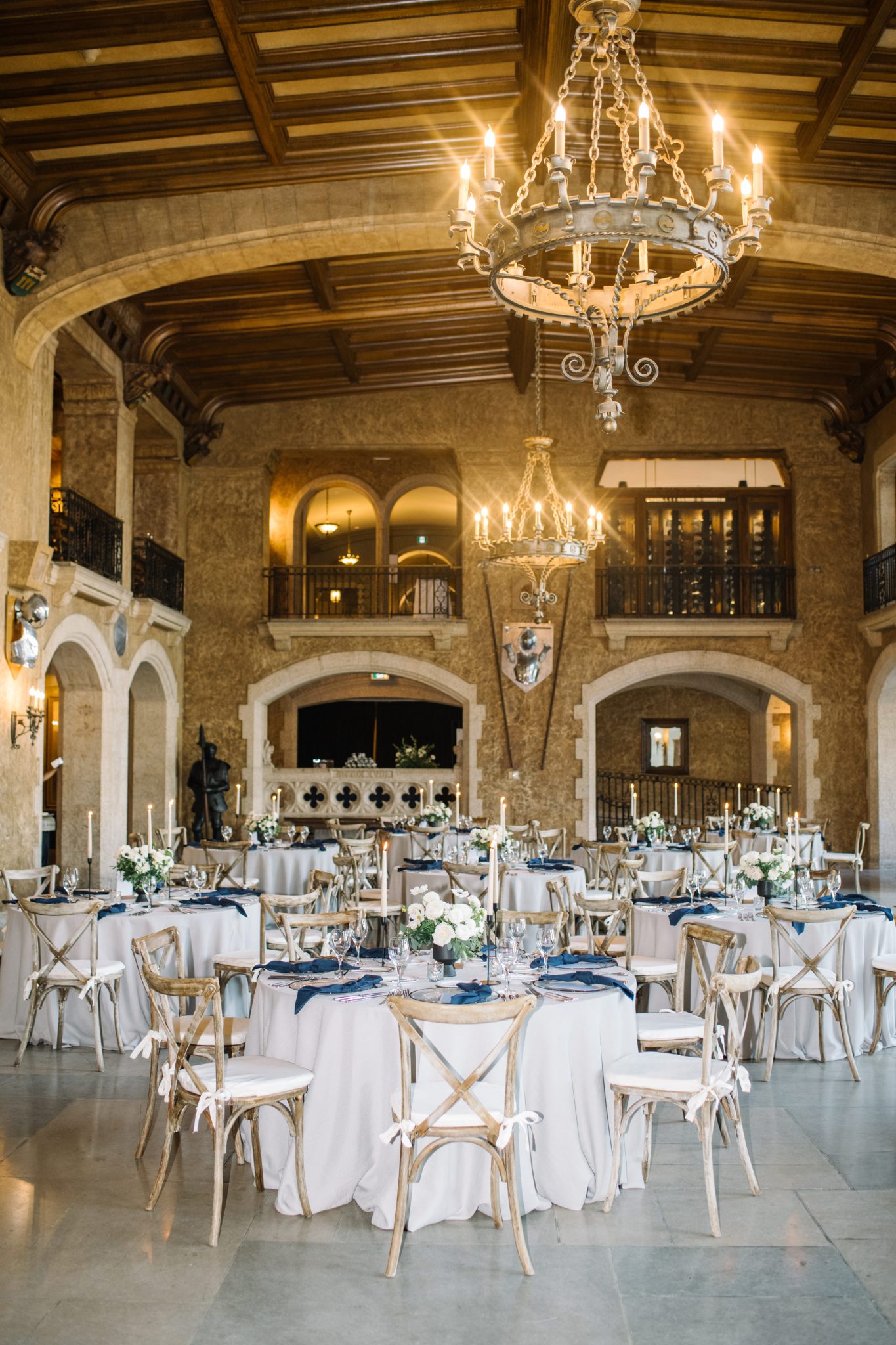 Reception table setup with white florals and navy accents at a Fairmont Banff Springs Wedding.
