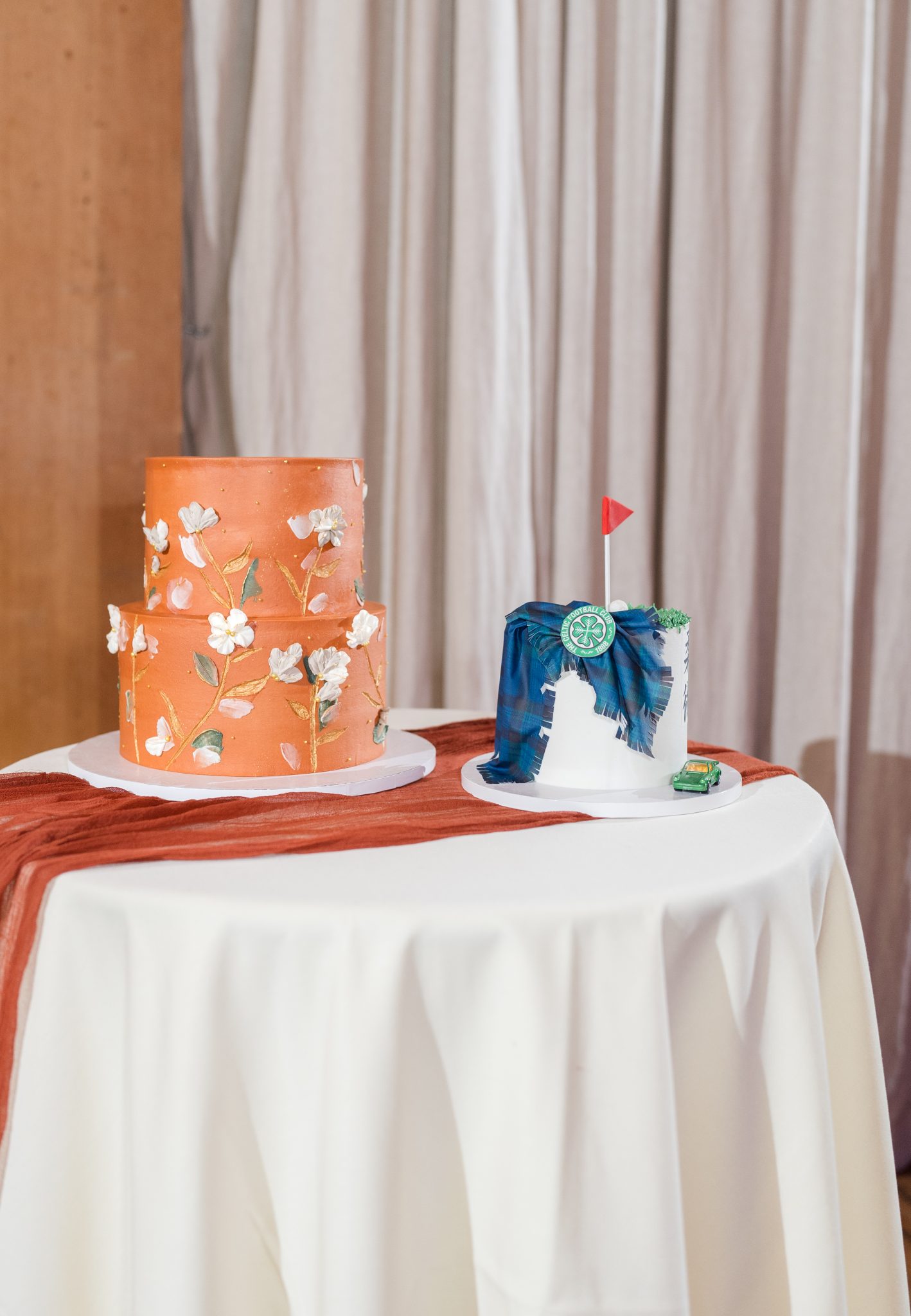 Autumn-inspired wedding cakes, including a custom groom kilt cake, at a Utah fall wedding reception.