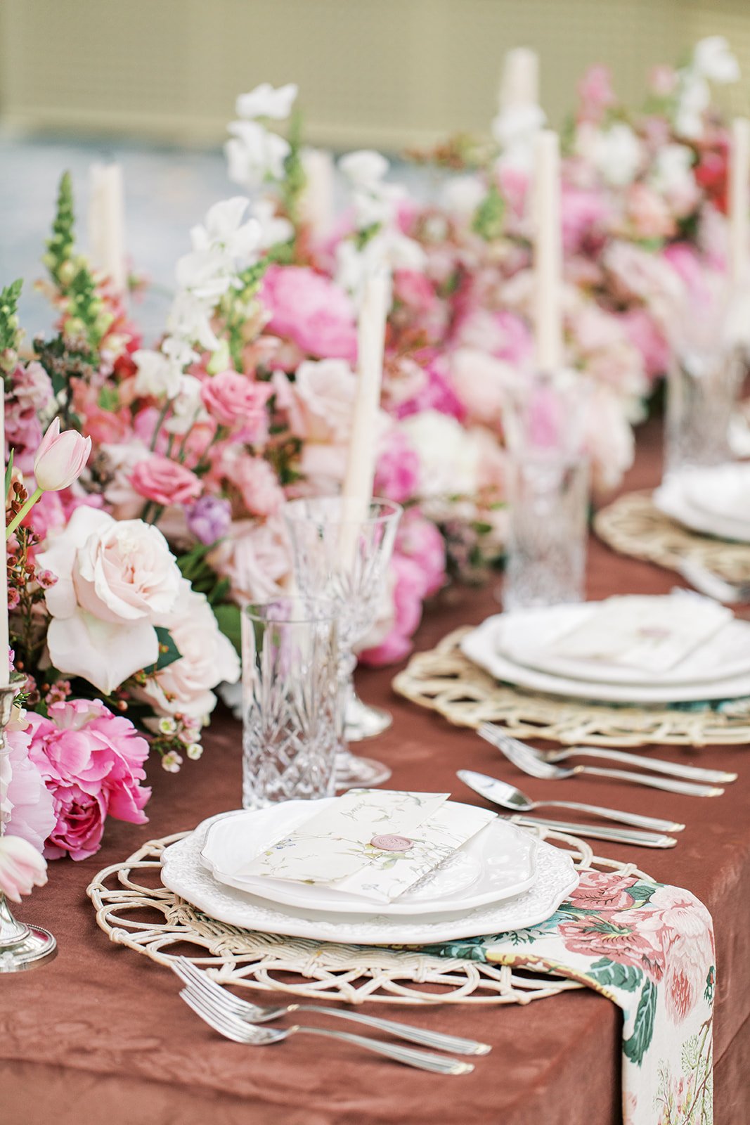 Close-up of the wedding reception table with floral accents and crystal glassware, a Romantic Pink Alberta Wedding Inspiration.