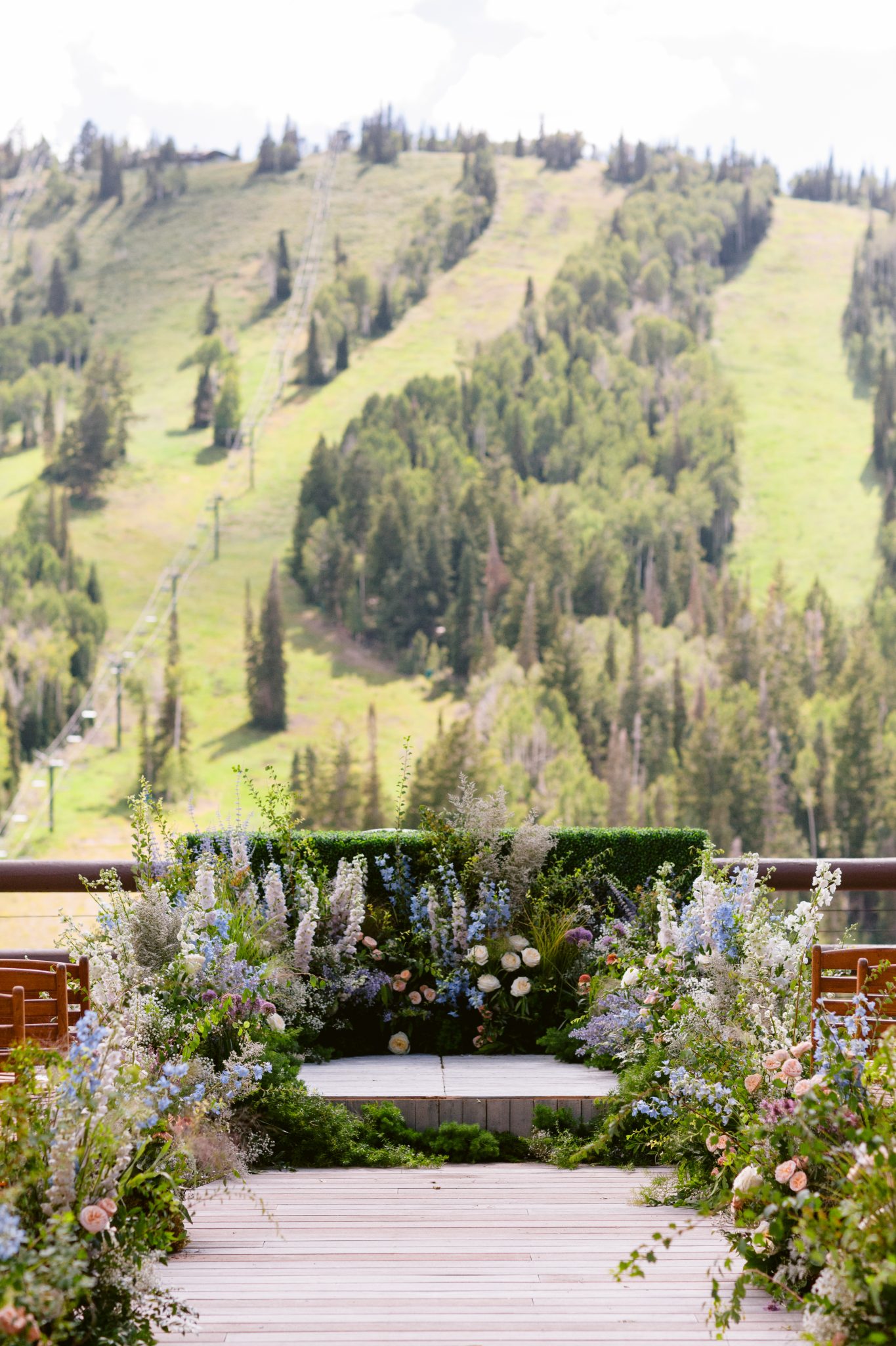 Stunning mountain backdrop framing the wedding ceremony at Stein Eriksen Lodge in the summer.
