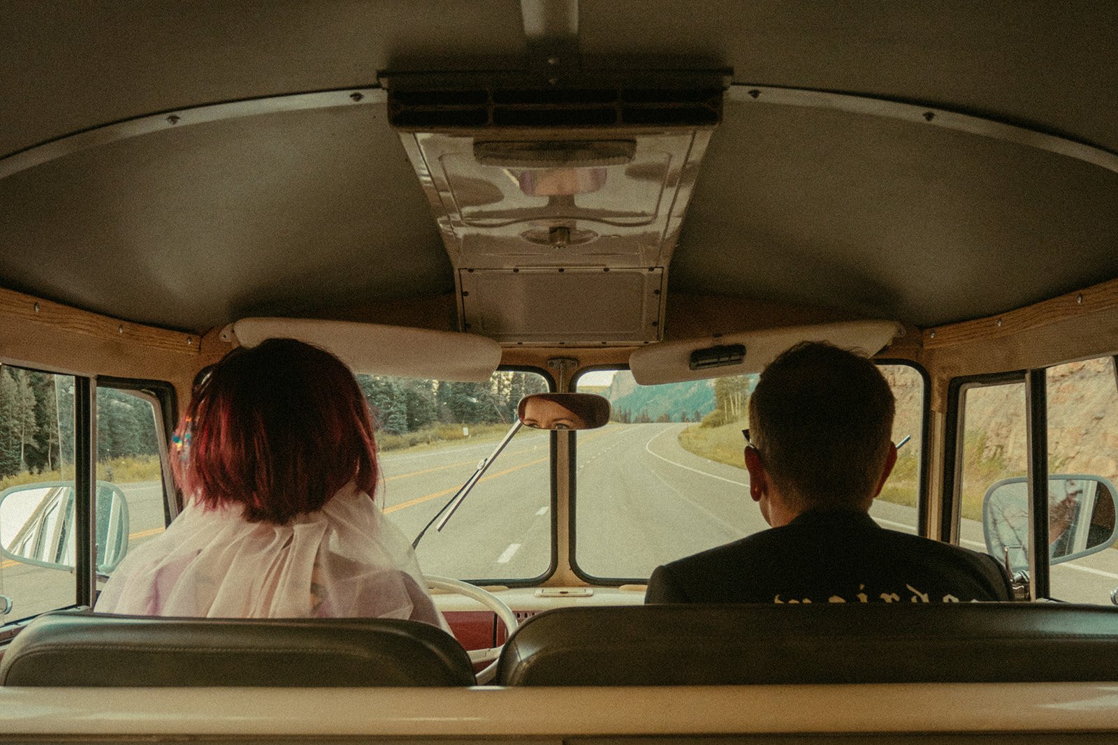 A nostalgic moment captured inside a vintage van during a Hanna Irene Motion Pictures Durango Elopement, with the couple on a scenic road journey.