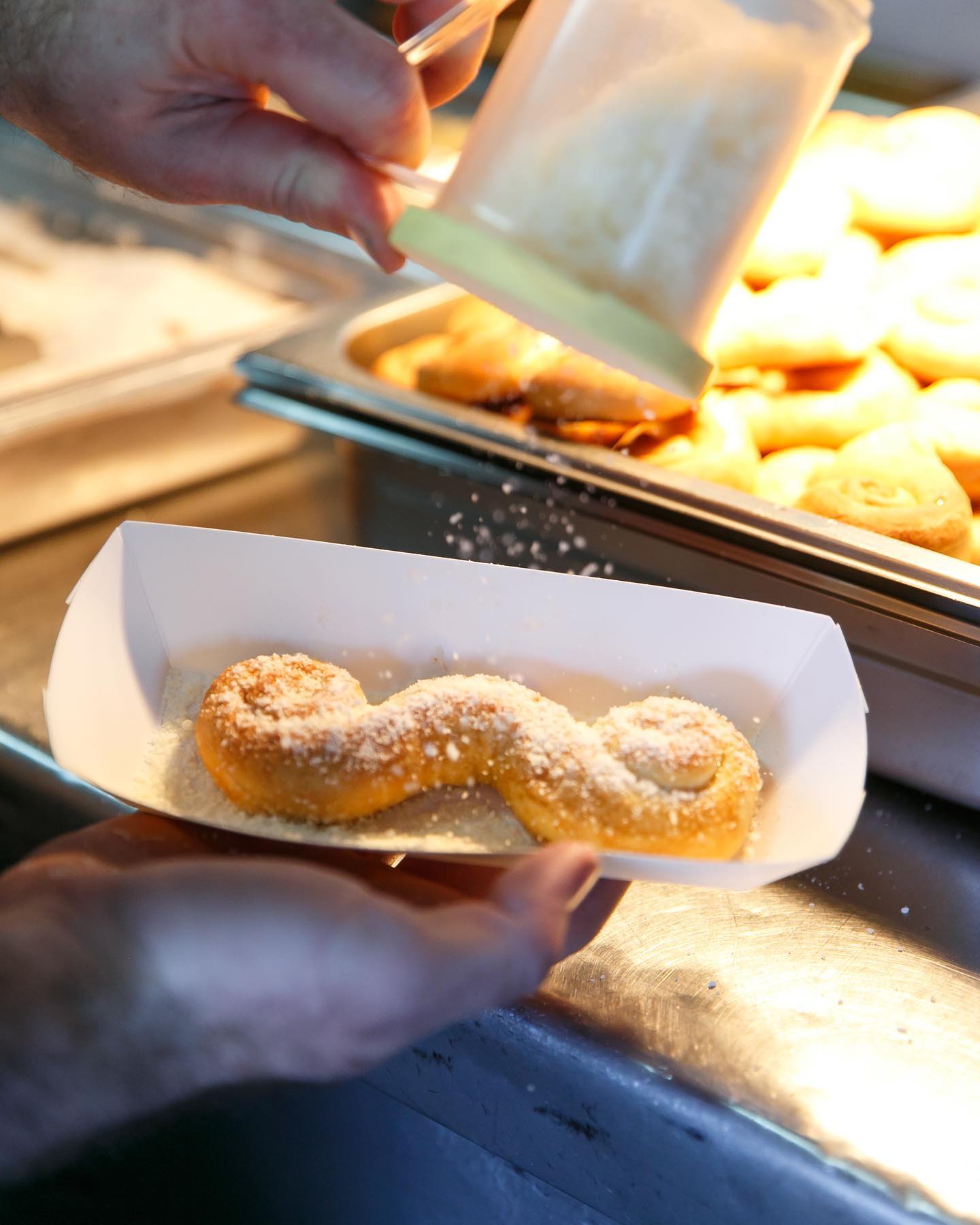 Soft, golden brown pretzels shaped like mustaches from Mustache Pretzels, a quirky and tasty Arizona wedding snack.