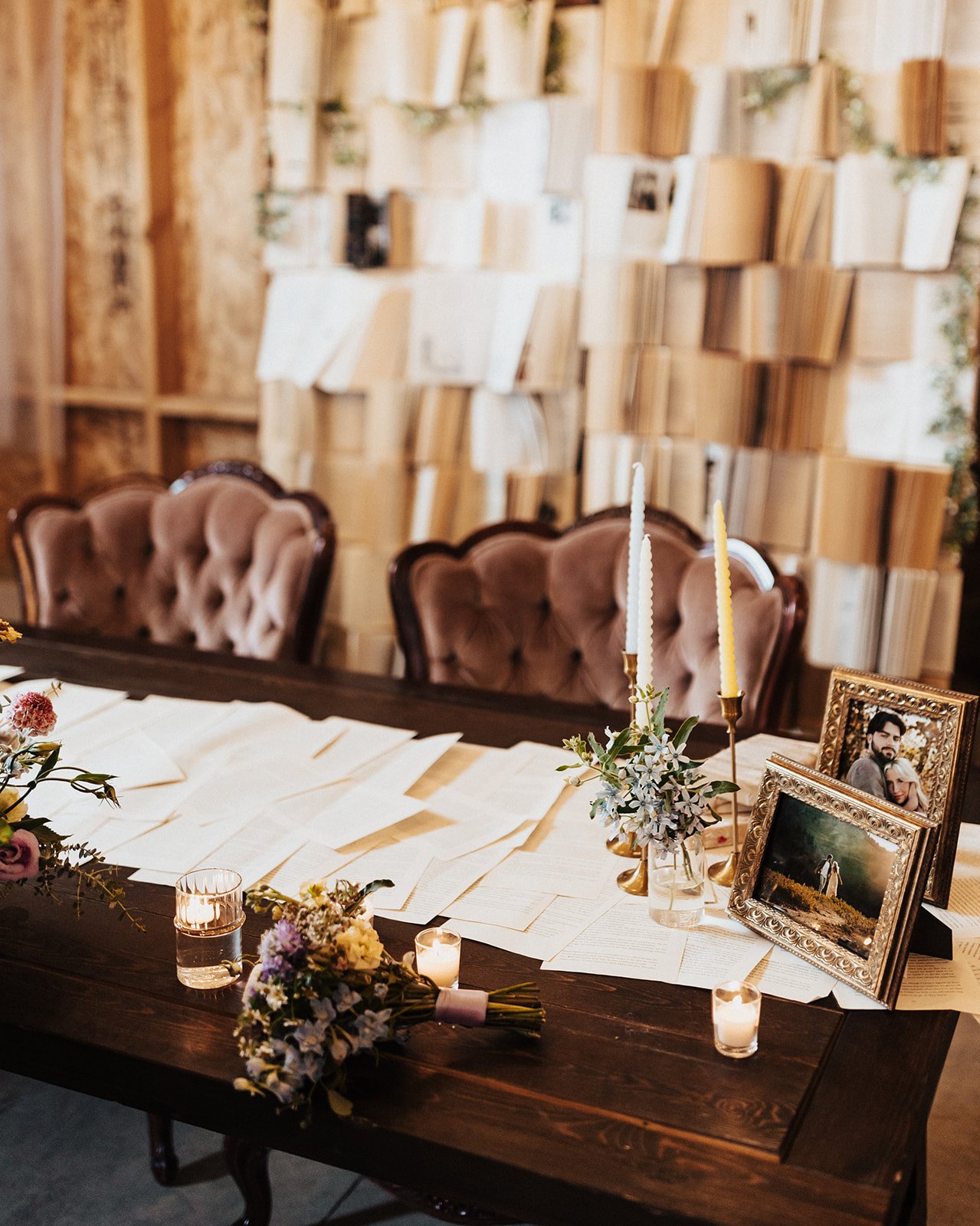 Vintage-inspired sweetheart table with an open book backdrop and candlelit décor at a fall Utah wedding.
