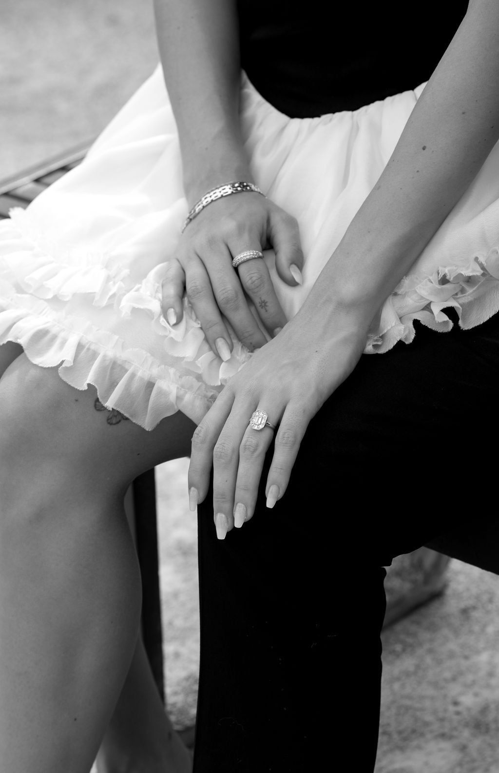 Detail shot of bride’s engagement ring and hands in a playful dress during a Downtown Las Vegas engagement rocky mountain bride shoot.