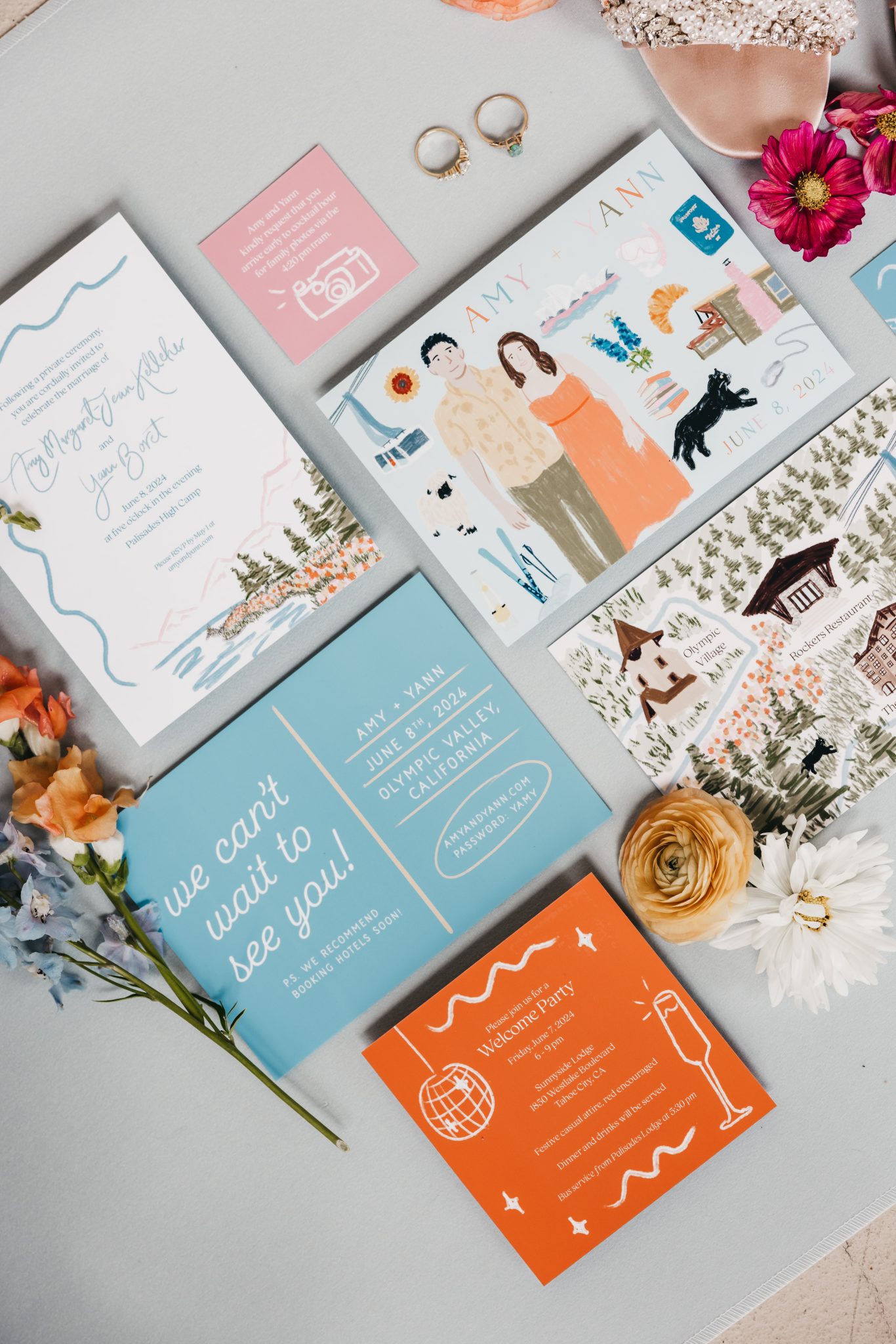 A colorful flat lay of illustrated invitations and save-the-dates with floral accents, showcasing the playful details of a Palisades Tahoe spring wedding rocky mountain bride.