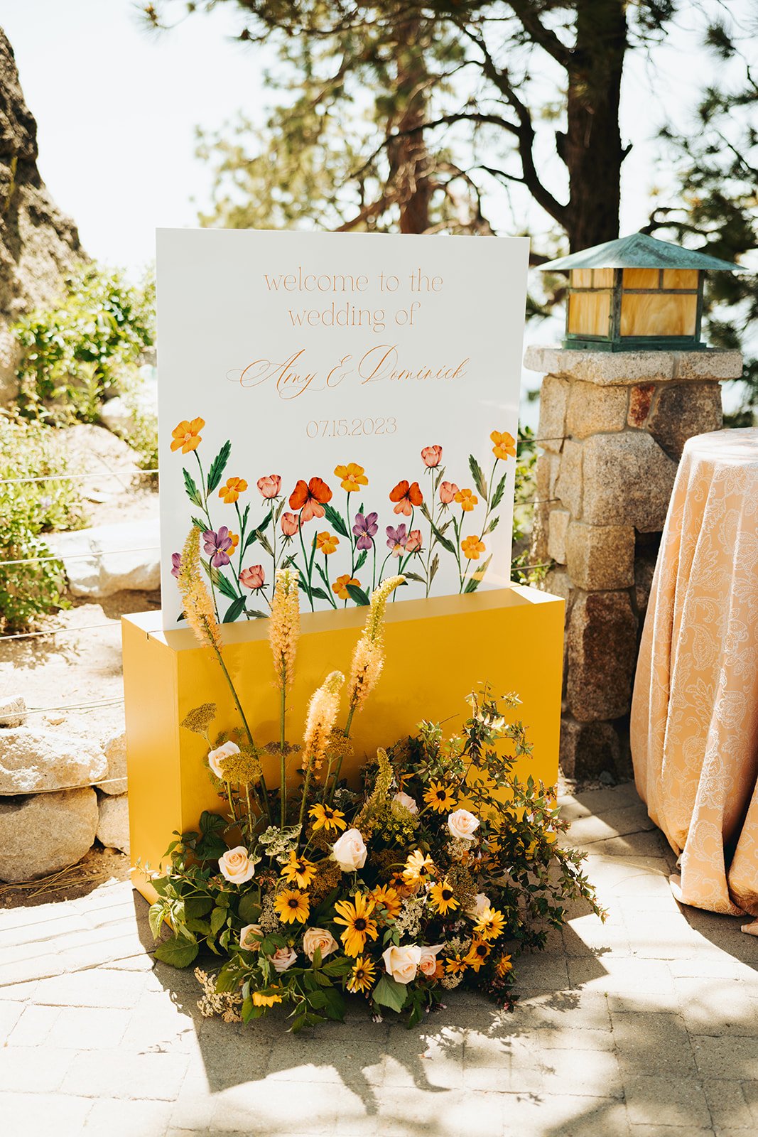 Illustrated floral welcome sign for Amy and Dominick’s Tahoe Blue Estate summer wedding rocky mountain bride.
