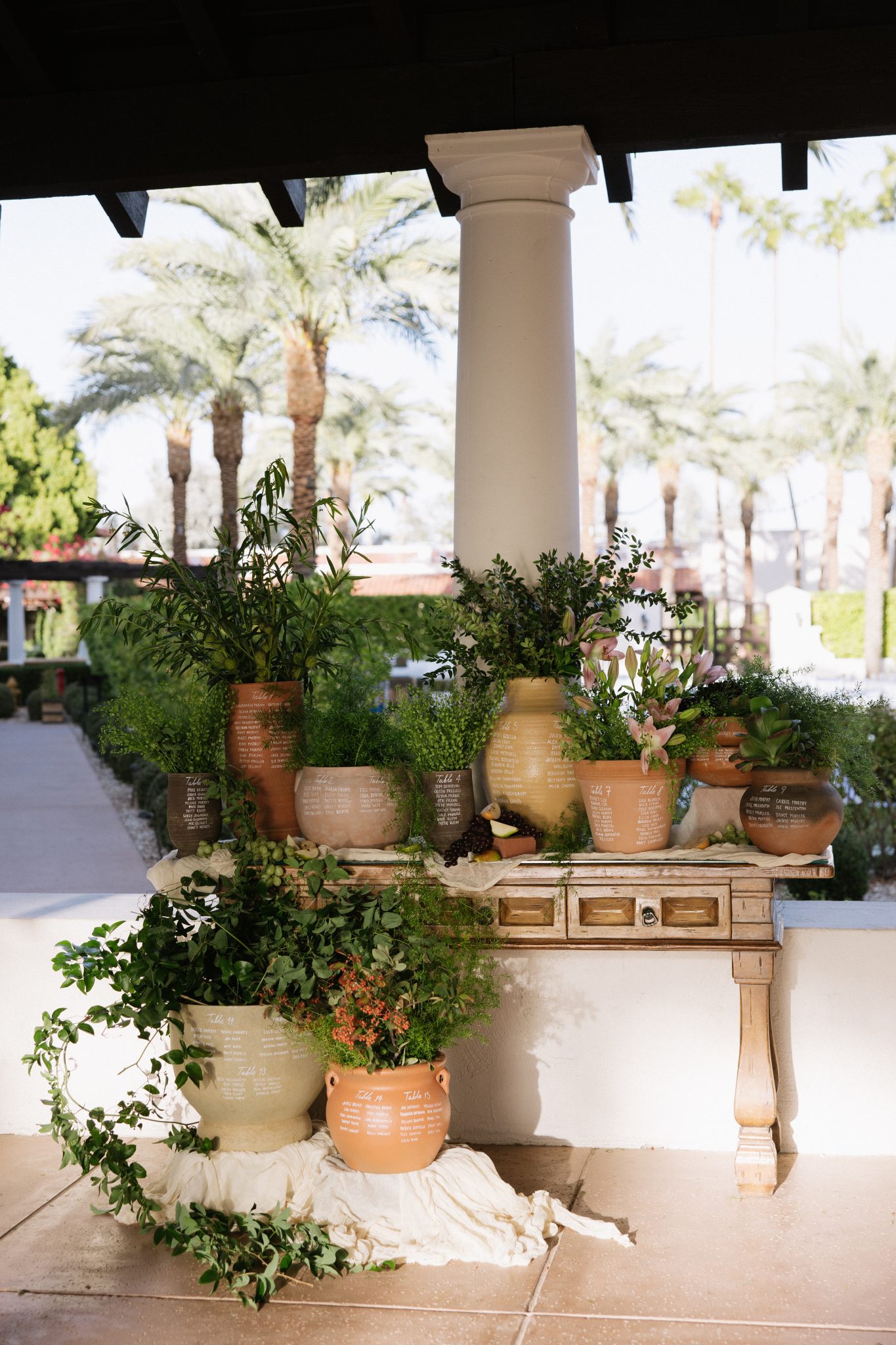 Unique escort card display in terracotta pots at The Scottsdale Resort & Spa fall wedding rocky mountain bride.