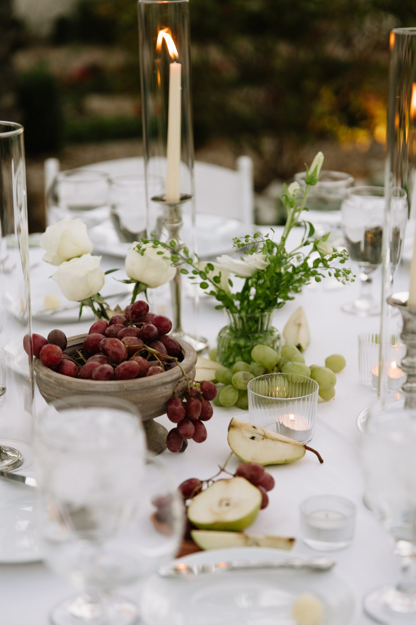 Fall-inspired reception table at The Scottsdale Resort & Spa fall wedding rocky mountain bride with grapes, pears, and white florals.