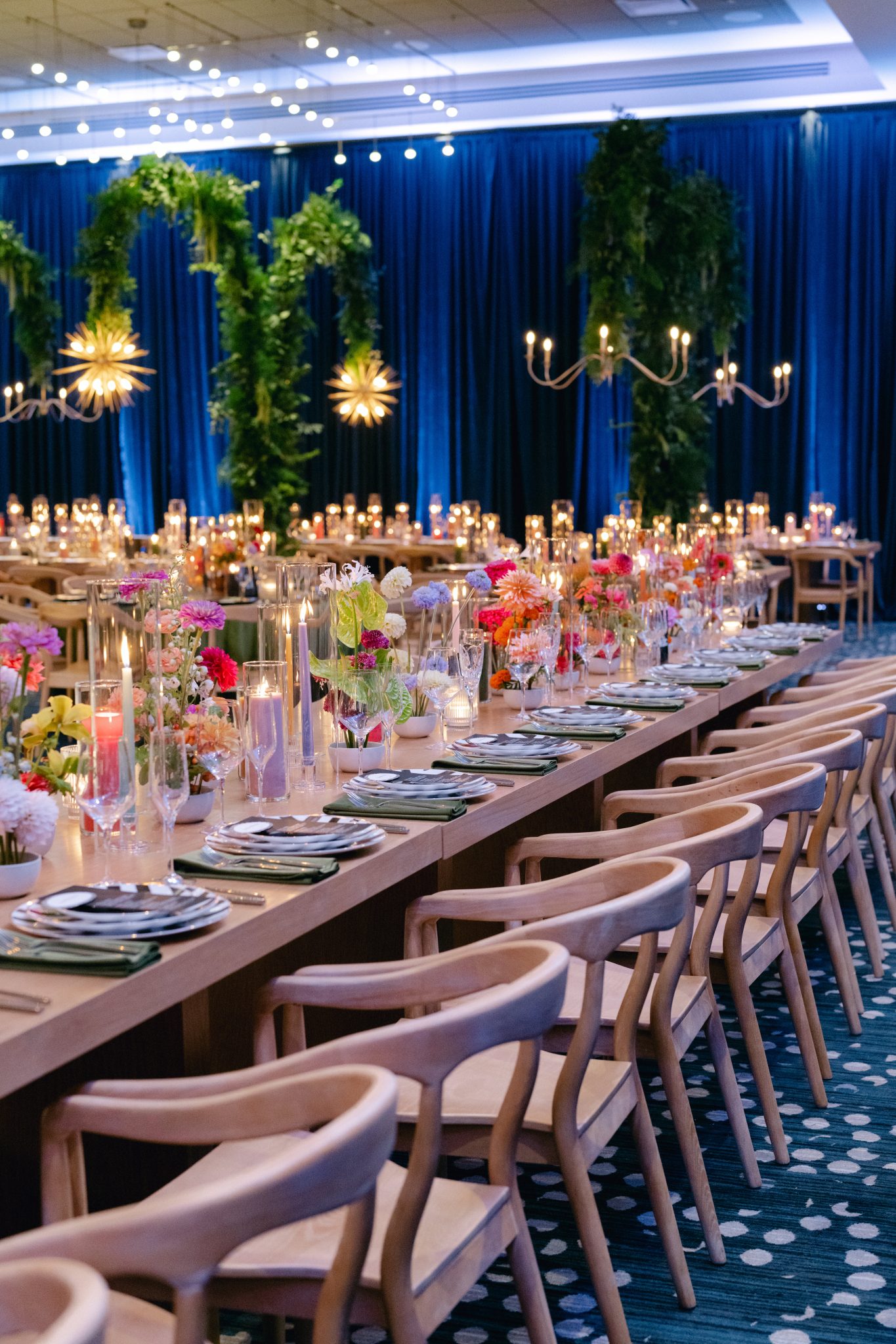 Luxurious indoor wedding reception with floral centerpieces and ambient lighting at a Downtown Denver Colorado wedding rocky mountain bride venue.