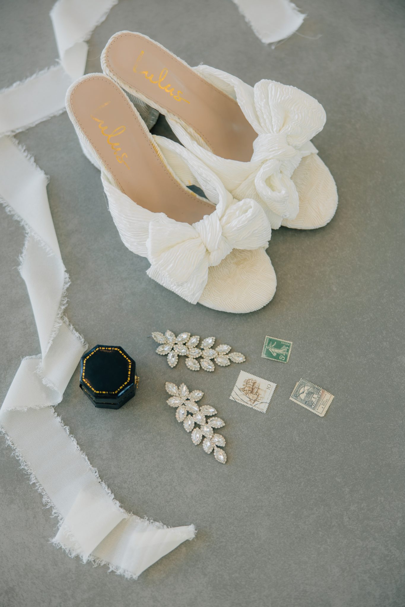 bridal details: heels, earrings, ring