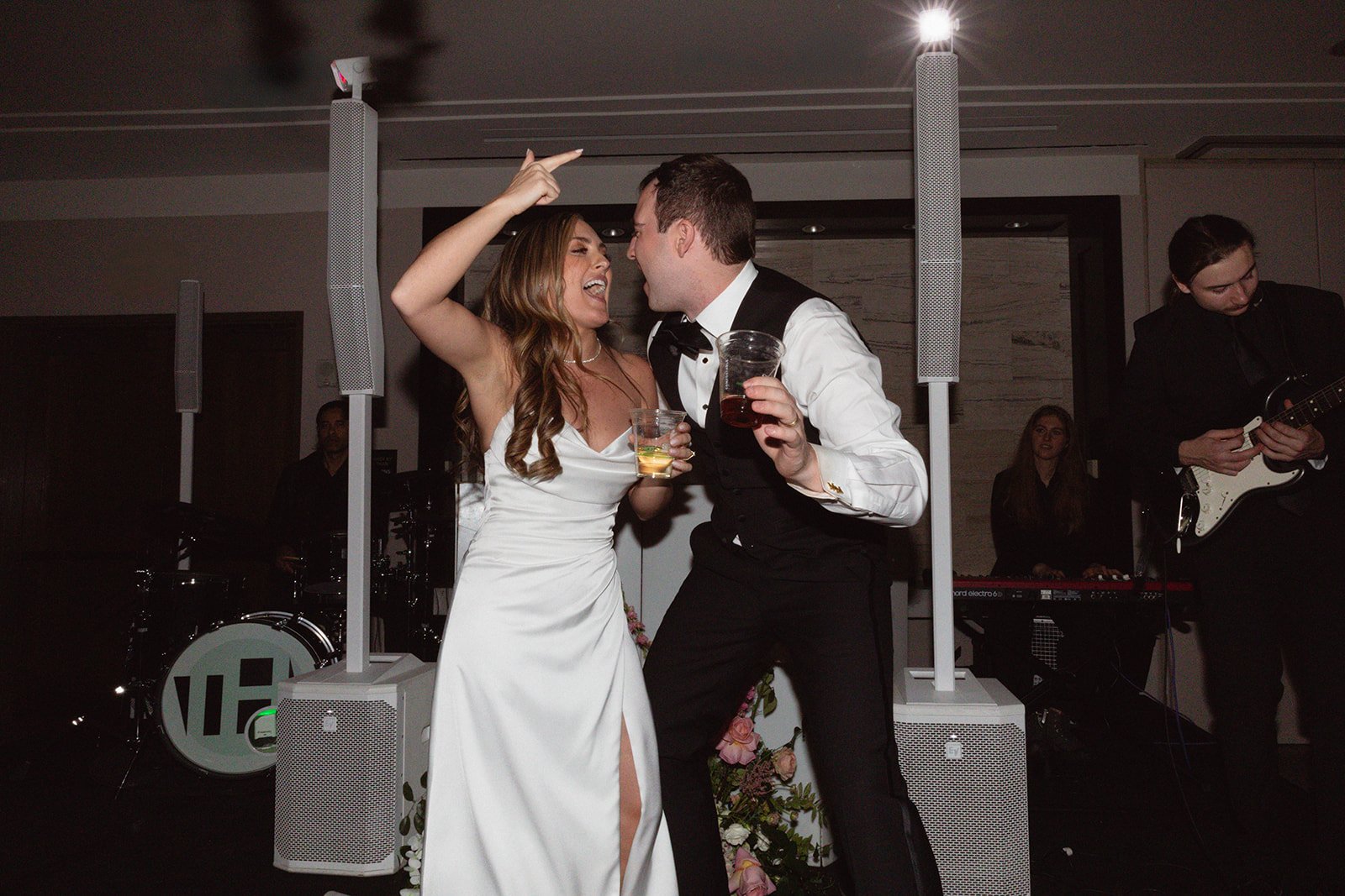 Bride and groom celebrating on the dance floor with live music at a Bailey Richy Events & Design colorado wedding at The Westin Riverfront Resort & Spa rocky mountain bride.